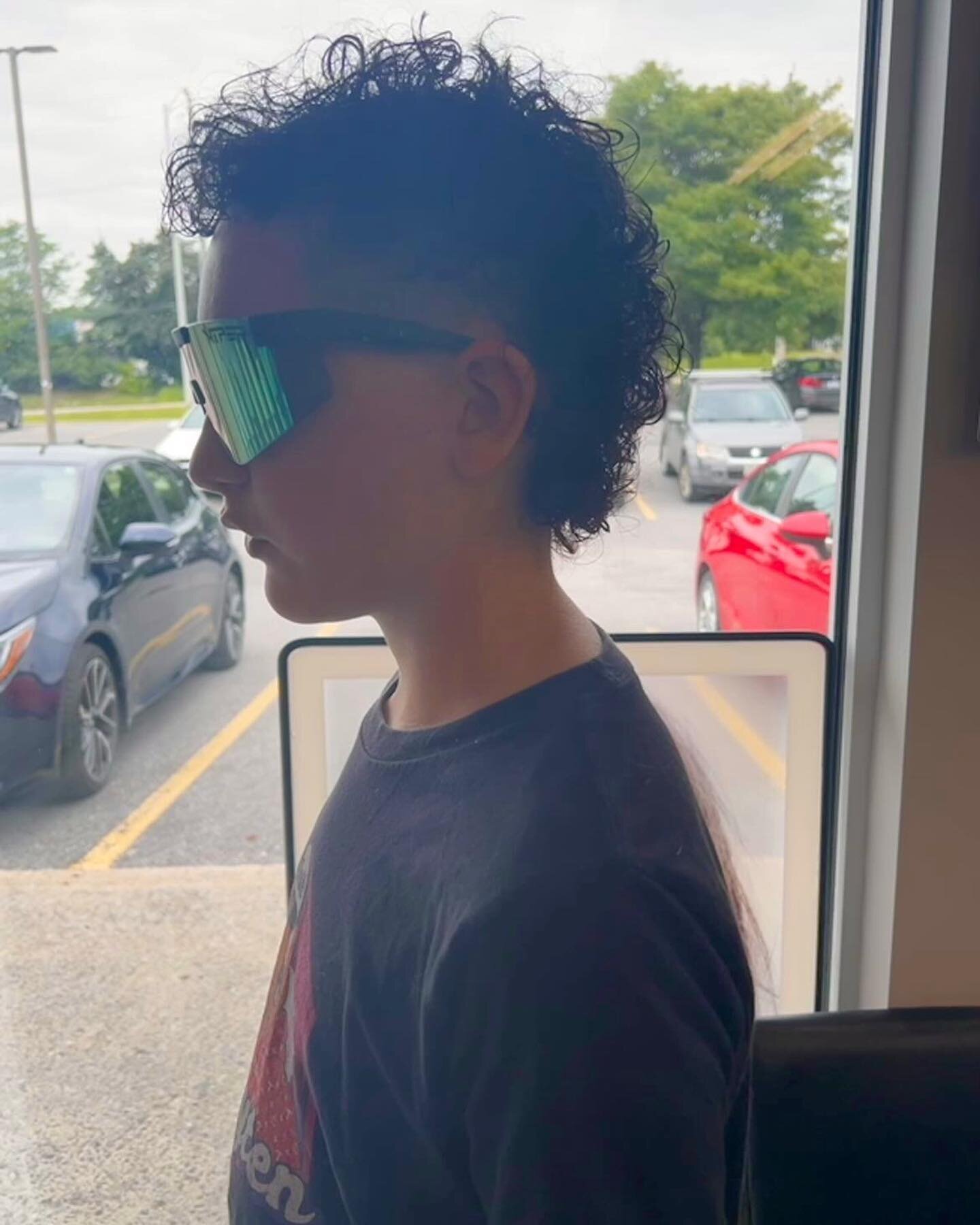 We style many cool cuts on many cool dudes and this guy is no exception! He sports his natural curls with a mullet style and the coolest shades ever! If you like this cut and style give us a call to book an appointment at 613-836-3435 or come in as a