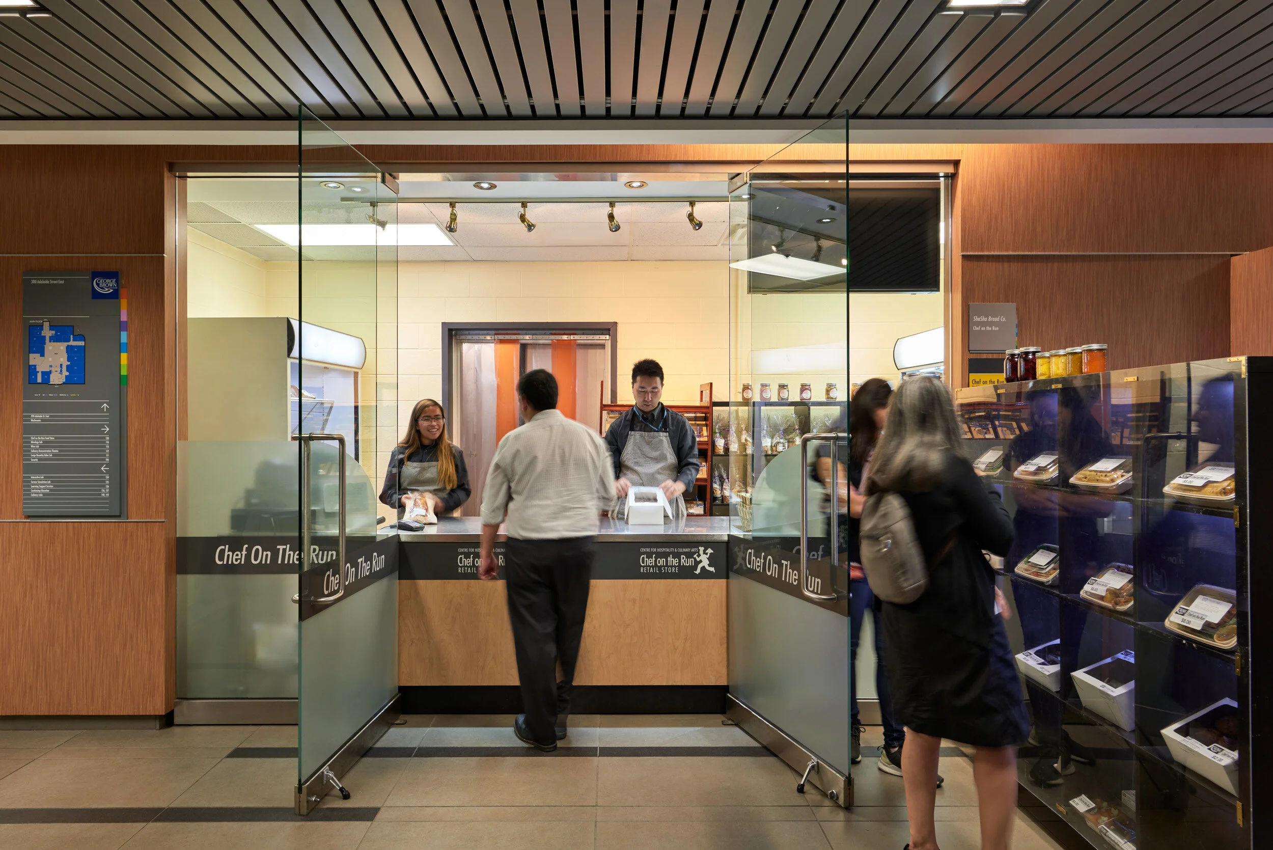 Guests being served at the Chef on the Run counter at The Centre for Hospitality & Culinary Arts, George Brown College, Toronto