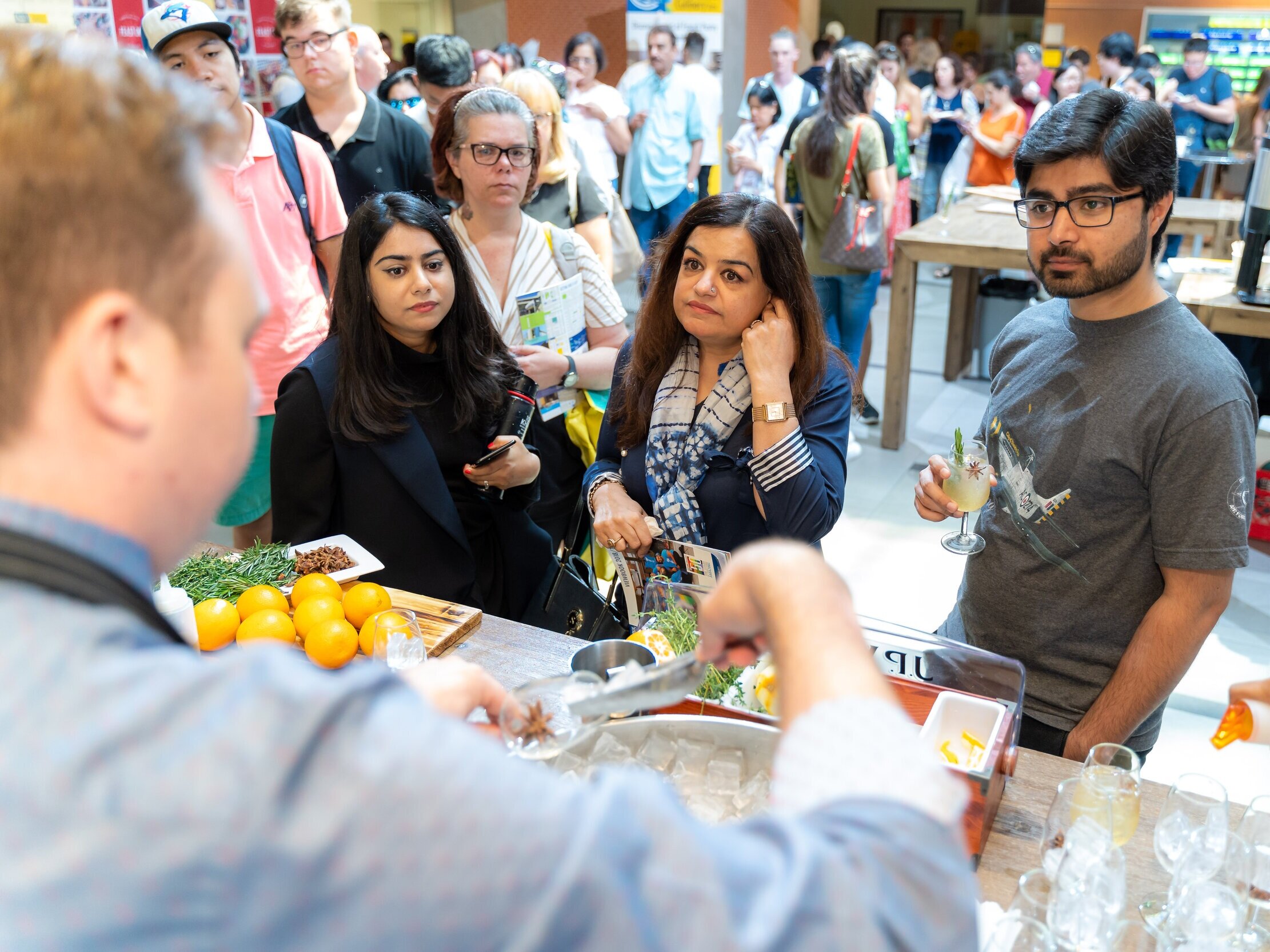 Guests attending a food & drink marketplace festival at George Brown College's Centre for Hospitality & Culinary Arts