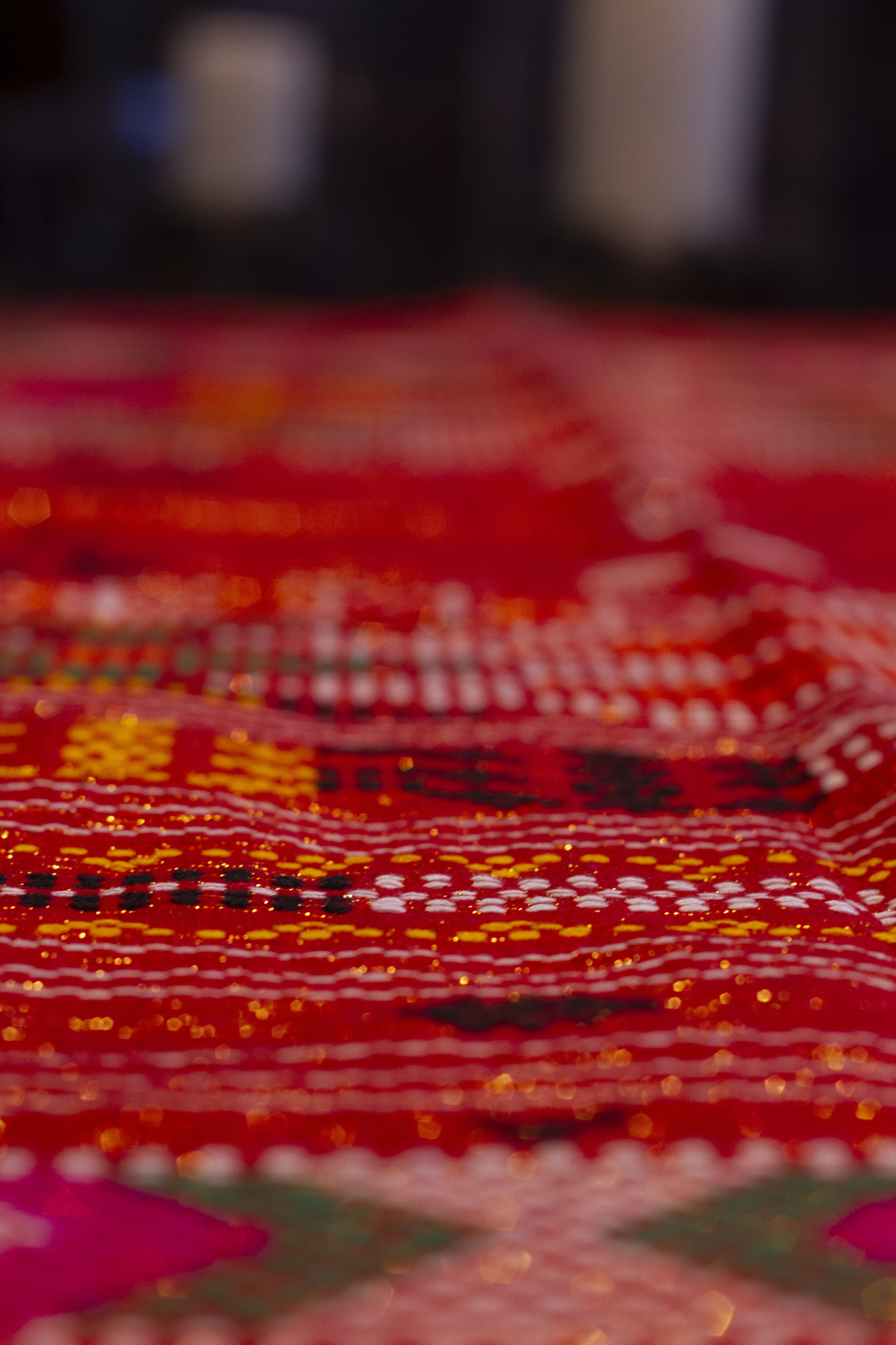denim backed red, green, yellow and white sadum tapestry