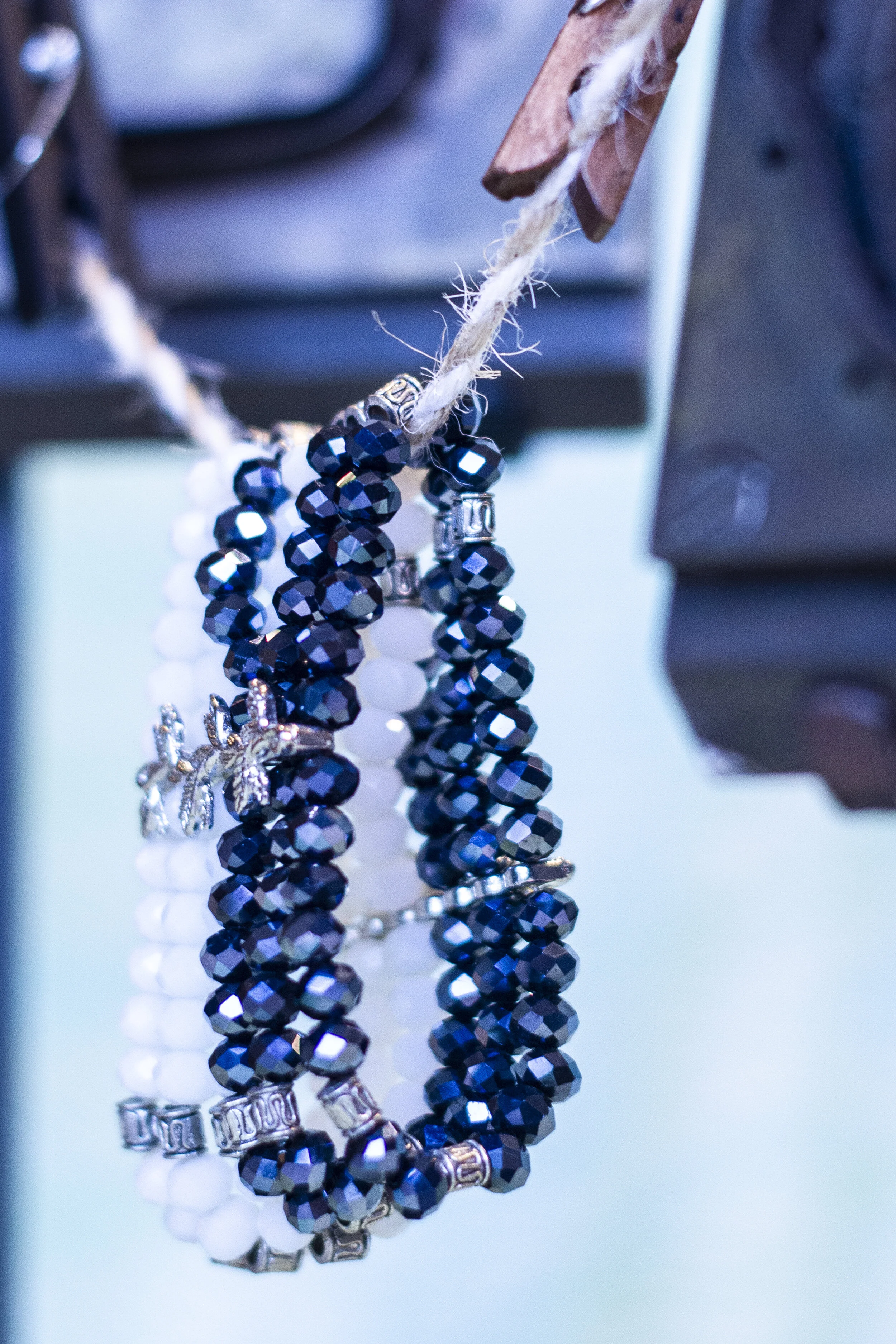 blue and chrome bracelets with metal charms