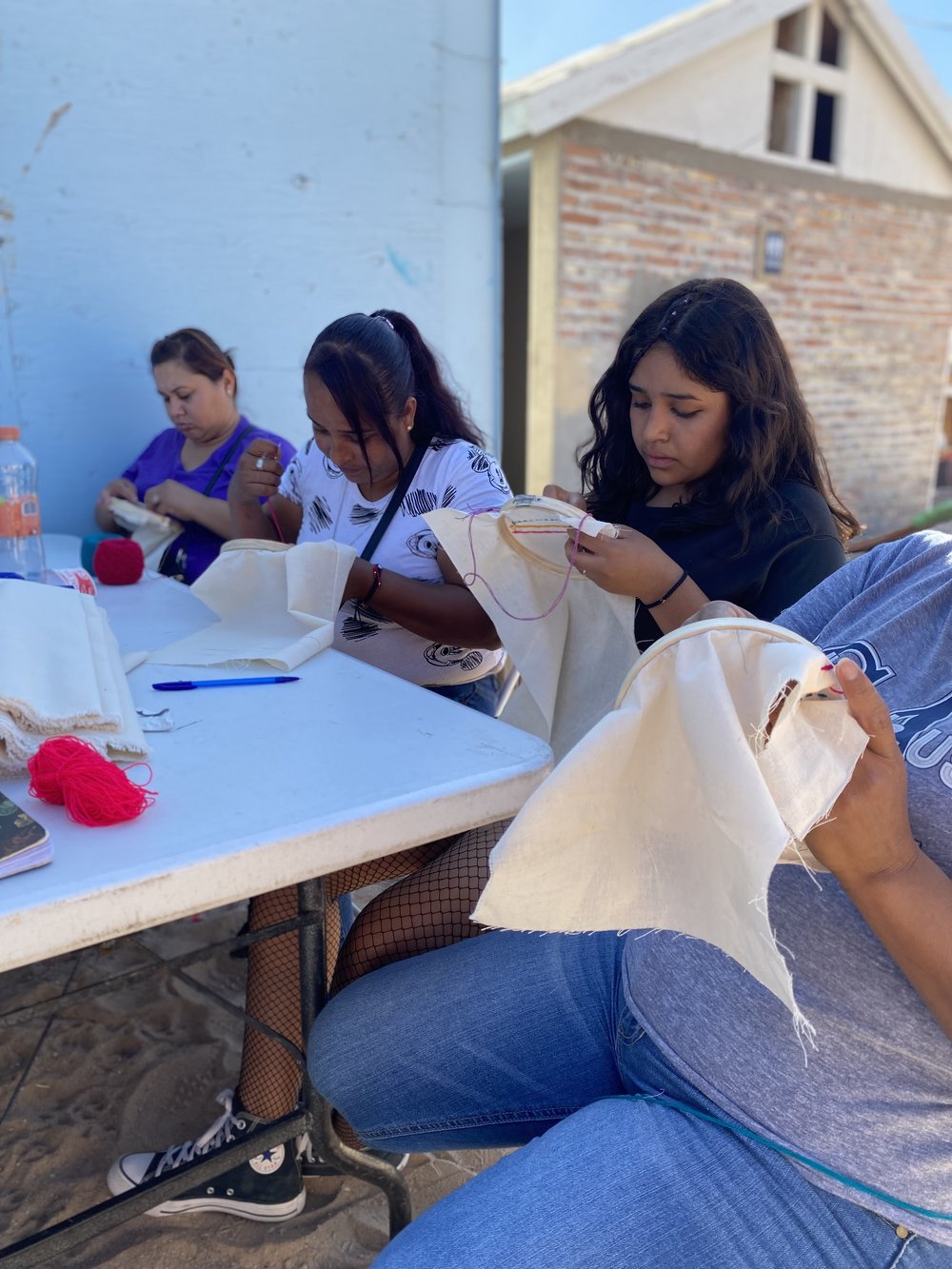 Women learn how to embroider