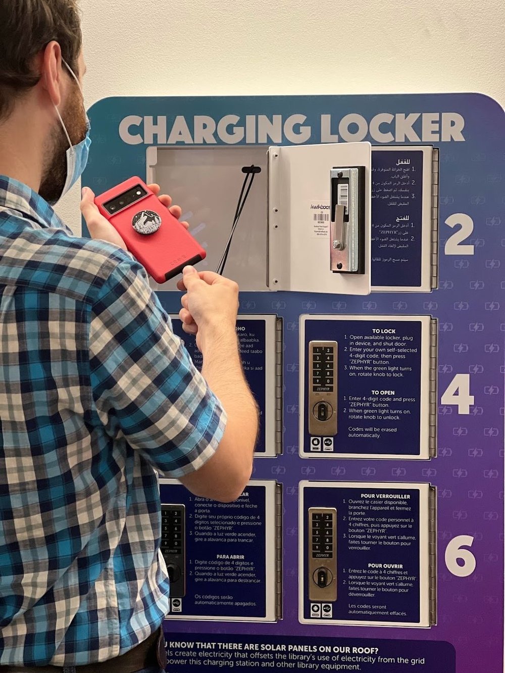 Juice up your phone in one of these handy charging lockers—note the variety of languages that explain how.