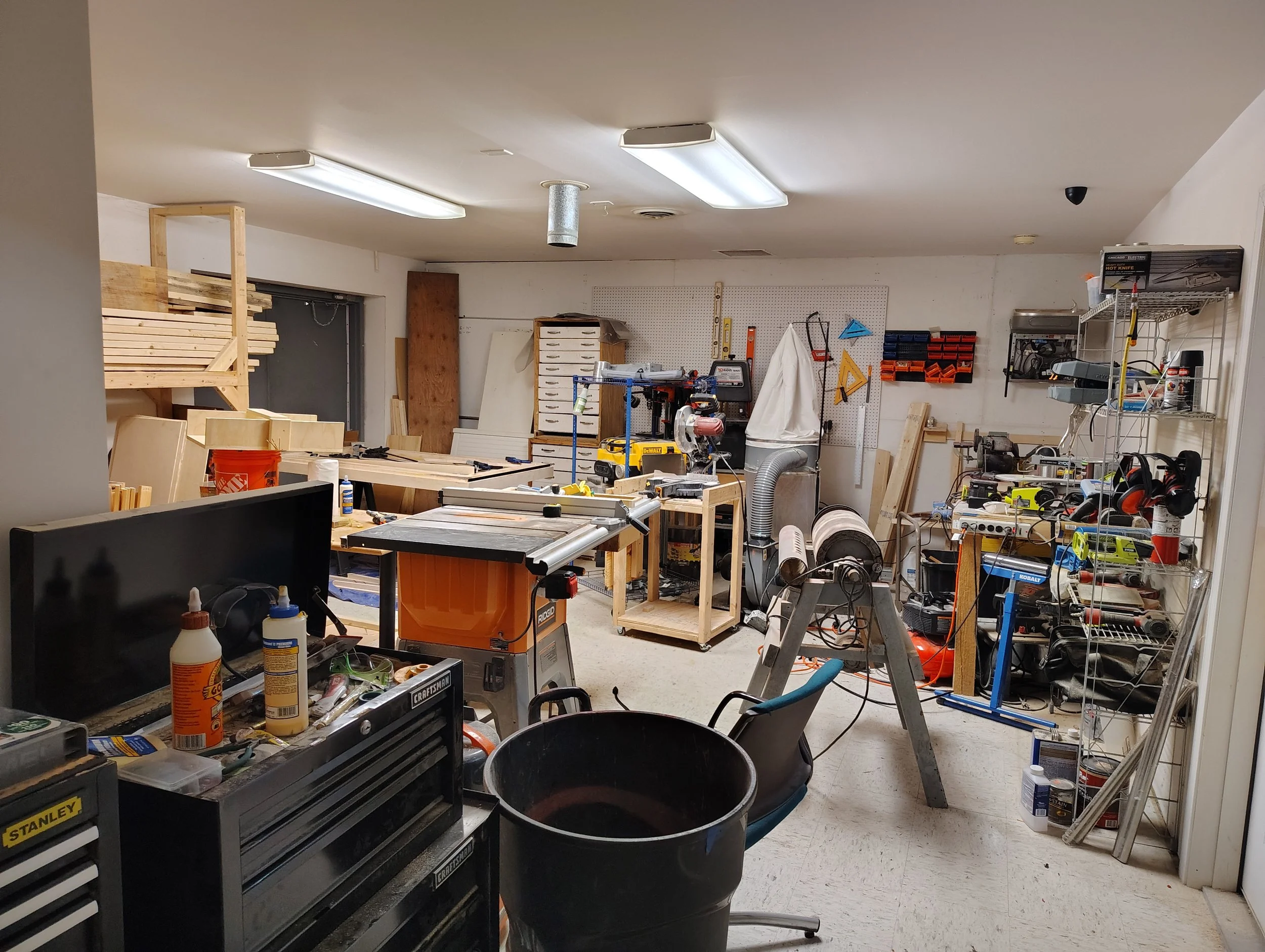 A room full of various equipment for woodworking and crafting