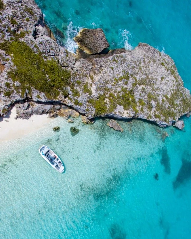 From above, it&rsquo;s easy to see why we love what we do 💙
Miles of untouched coastline, teal-green estuaries, coral shallows, and not another boat in sight this is the Turks &amp; Caicos most people never get to see.

Our crew Steve, Cynthia, Doc,