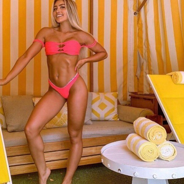 @andreacarmonaa posing next to our yellow ocean stripe at the @theconfidante ☀️