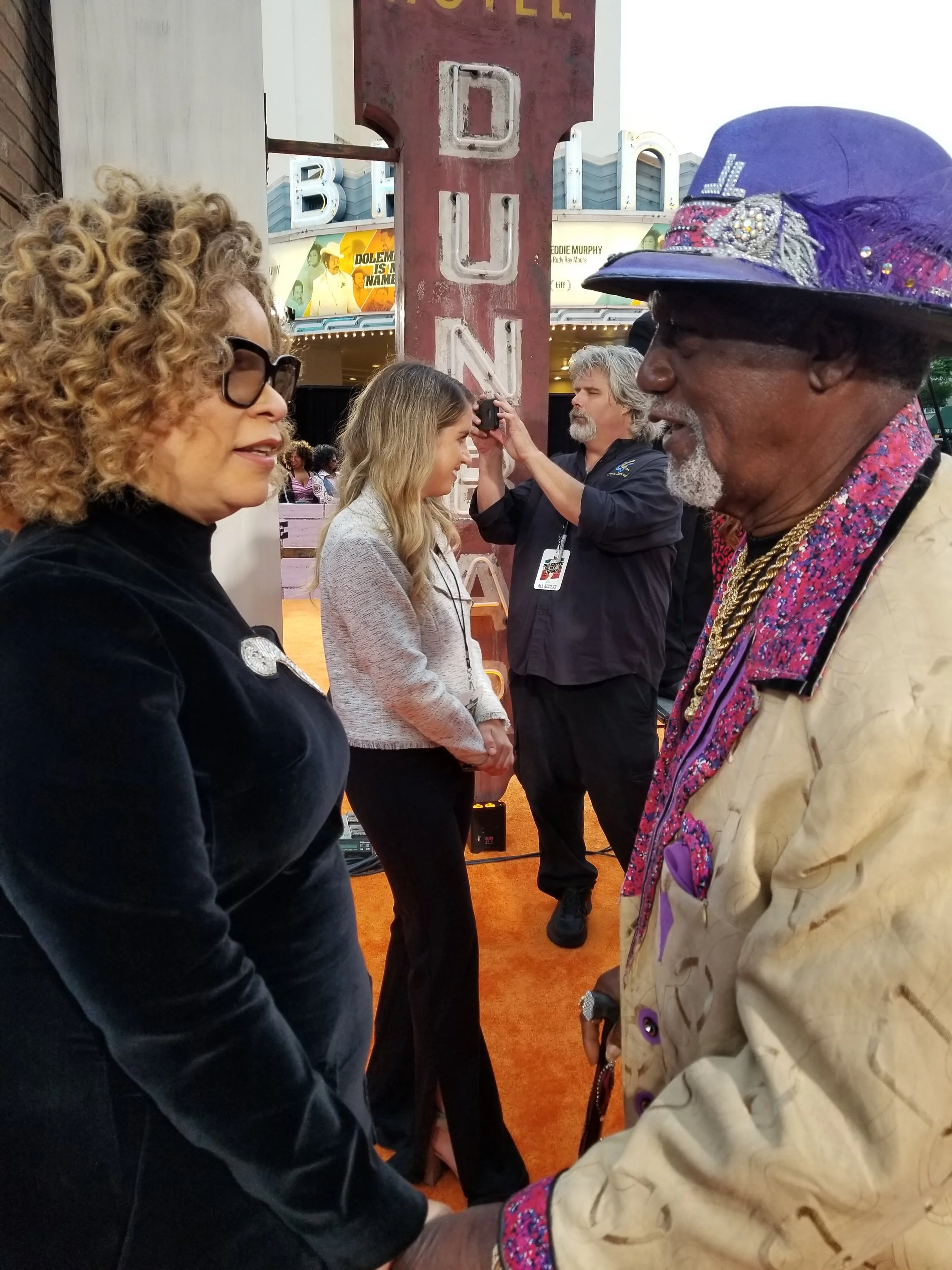 Oscar winner Ruth Carter and Jimmy Lynch discuss the costumes from the film. Lynch created many of the outfits from the original Rudy Ray Moore films.