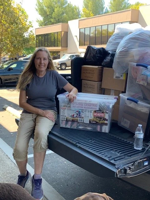 Karin with truck full of stuff for outreach.jpg