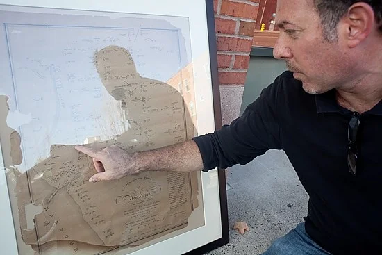 Construction Crew Unearths Colonial Gravestone When the stone came up Thursday, local historian Rob Greenberg was ready, filming the exhumation with his iPad. Greenberg, who has a passion for local lore, is the history buff who first (correctly) surmised that last year’s skeletal discovery also included a time capsule . Greenberg said the gravestone is a footstone, a marker for the end of a grave opposite the headstone. The stone has a jagged bottom and is carved into a semi-circles at the top. It reads simply “Mr. Stephen Howell.” Read the New Haven Independent article Construction Crew Unearths Gravestone