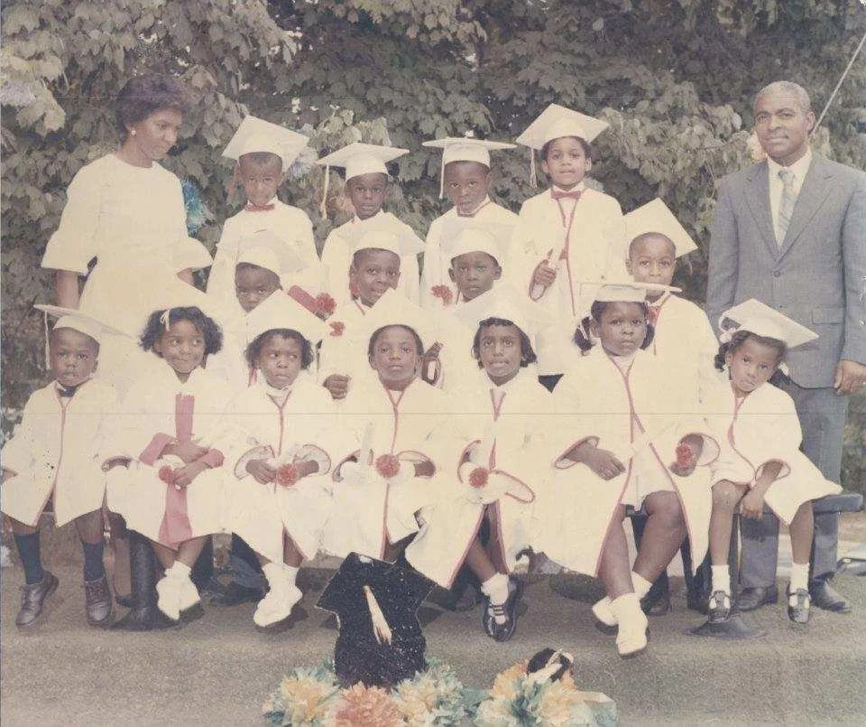Sister Margaret Muhammad and the children from the Vital Link Private School she co-founded with her husband, Kenneth Murray Muhammad