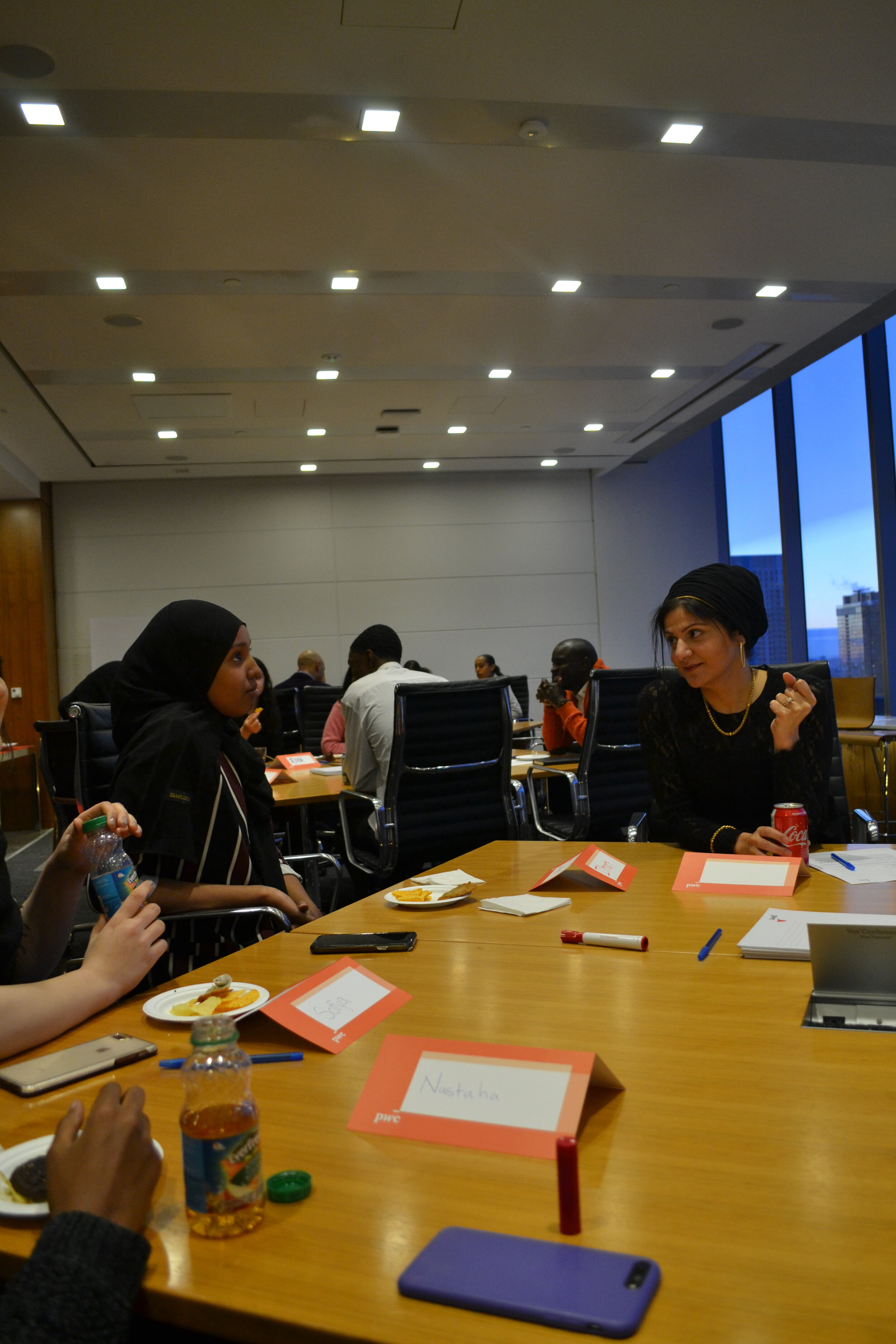  Ilhan speaking to Zainab Walji at the Financial Literacy event with BridgeTO in December 