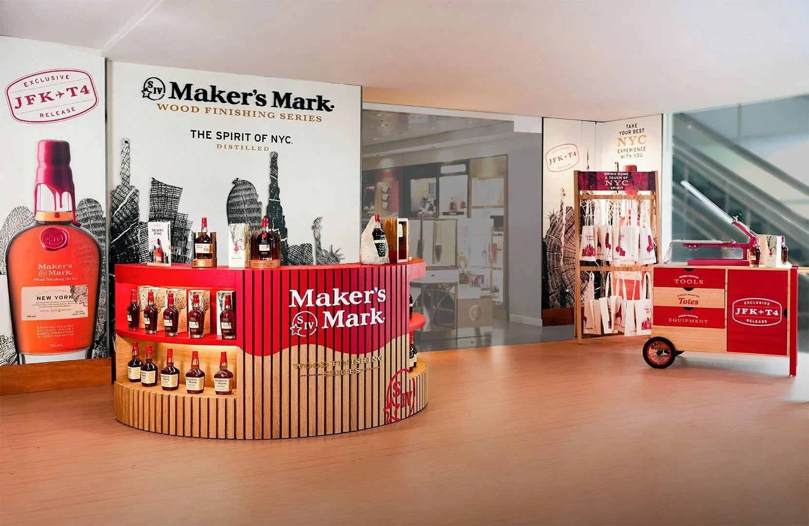  Maker’s Mark Wood Finishing Series display created by Wonderworks, featuring premium bourbon bottles on a curved branded counter with NYC skyline graphics and a stylish tasting cart. 