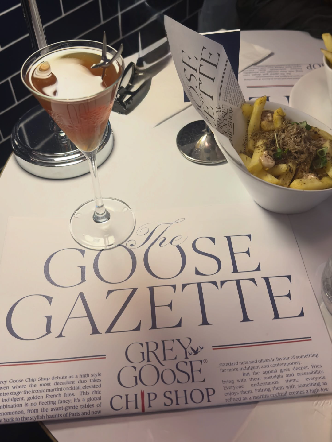  Grey Goose Chip Shop brand activation at 59 Greek Street, Soho, London this December, featuring a crafted cocktail, truffle fries, and The Goose Gazette branding for a stylish festive experience. 