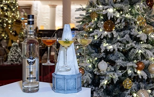  The Rotunda transformed into a winter wonderland with Beluga Vodka Martini Trees and Fir Tree Liqueur, set against a festive backdrop of snow-dusted Christmas trees adorned with golden ornaments and twinkling lights. 