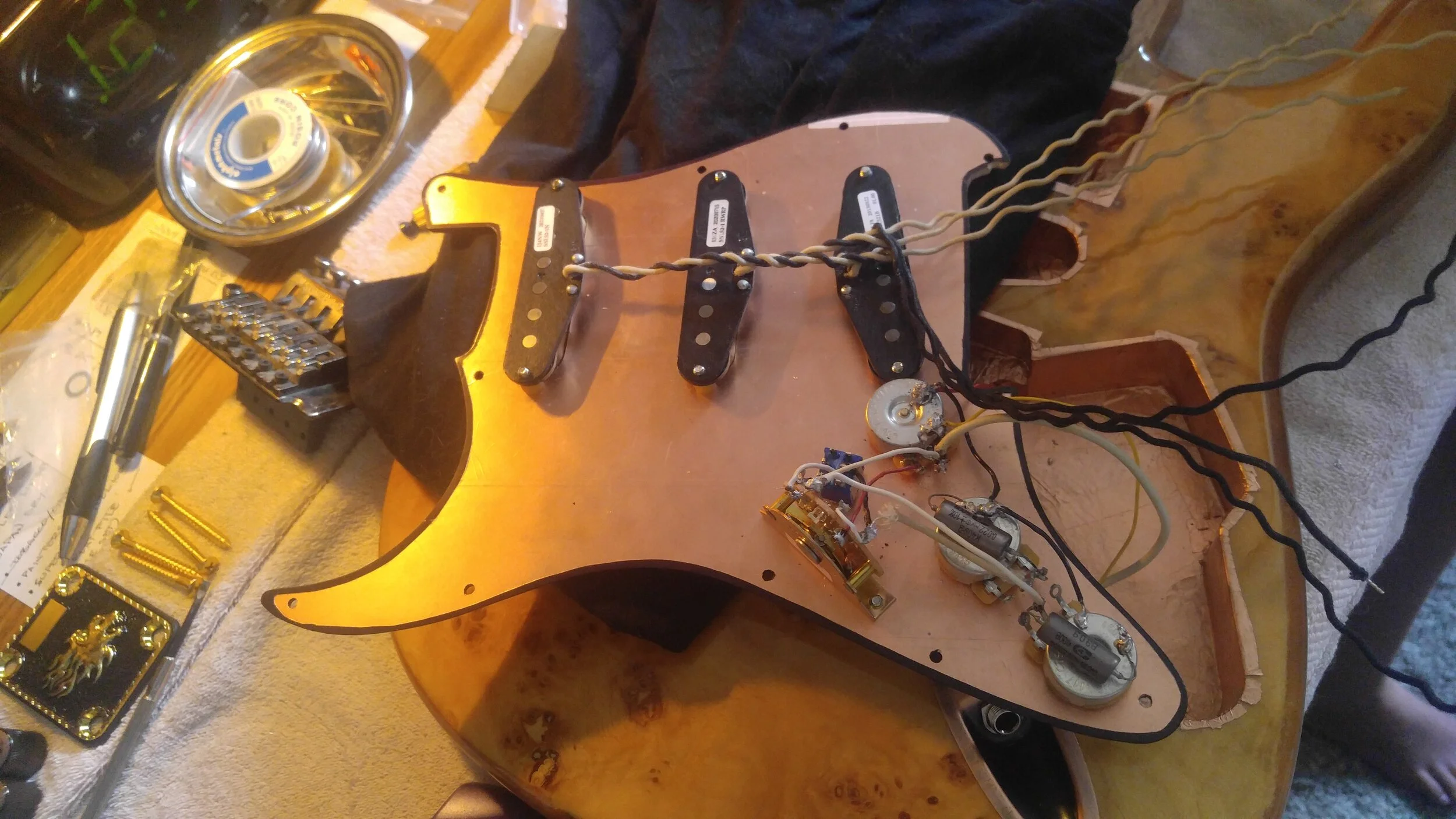 Wiring nearly  complete. Caps installed. All that remains to be wired are the pickups.  And, given this particular set of mods, it’s actually the easy part.