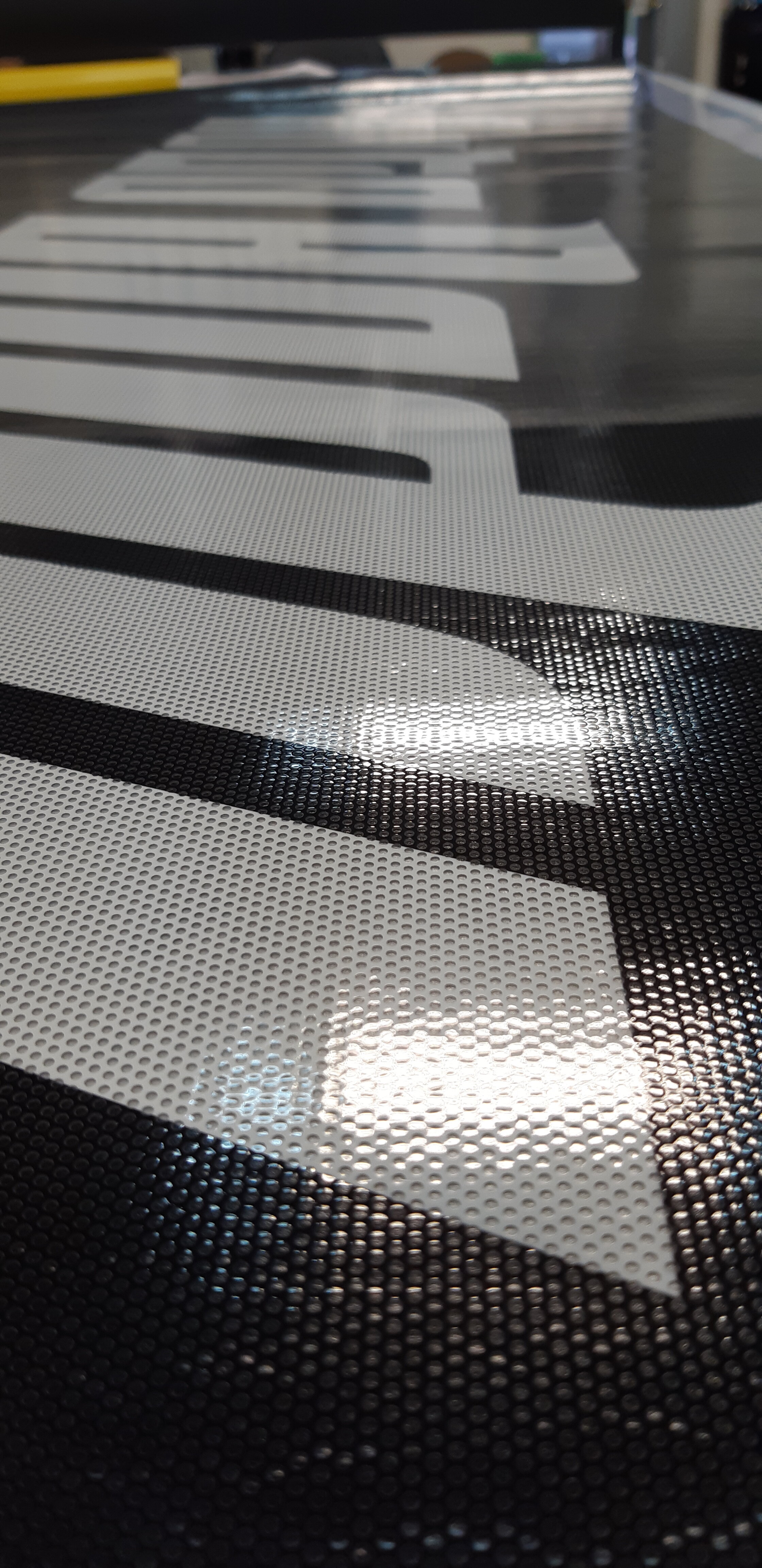 Miltown Signs perforated window graphics up close