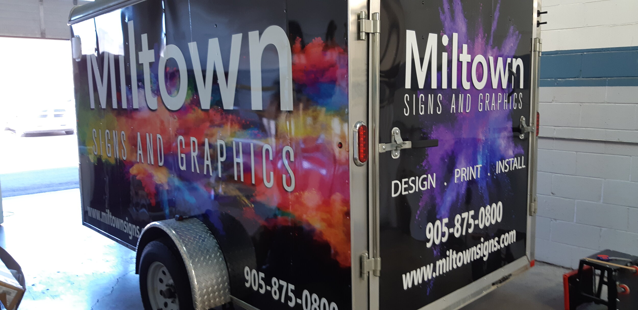 Miltown Signs installation trailer completely wrapped with vinyl graphics