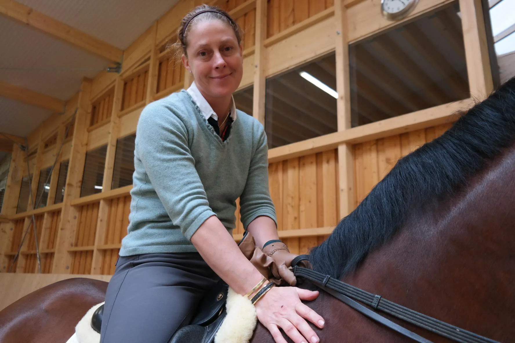 Emma Hindle, Olympic dressage rider, wearing her 18ct gold horsehair cuff by Enigma Horsehair Jewellery