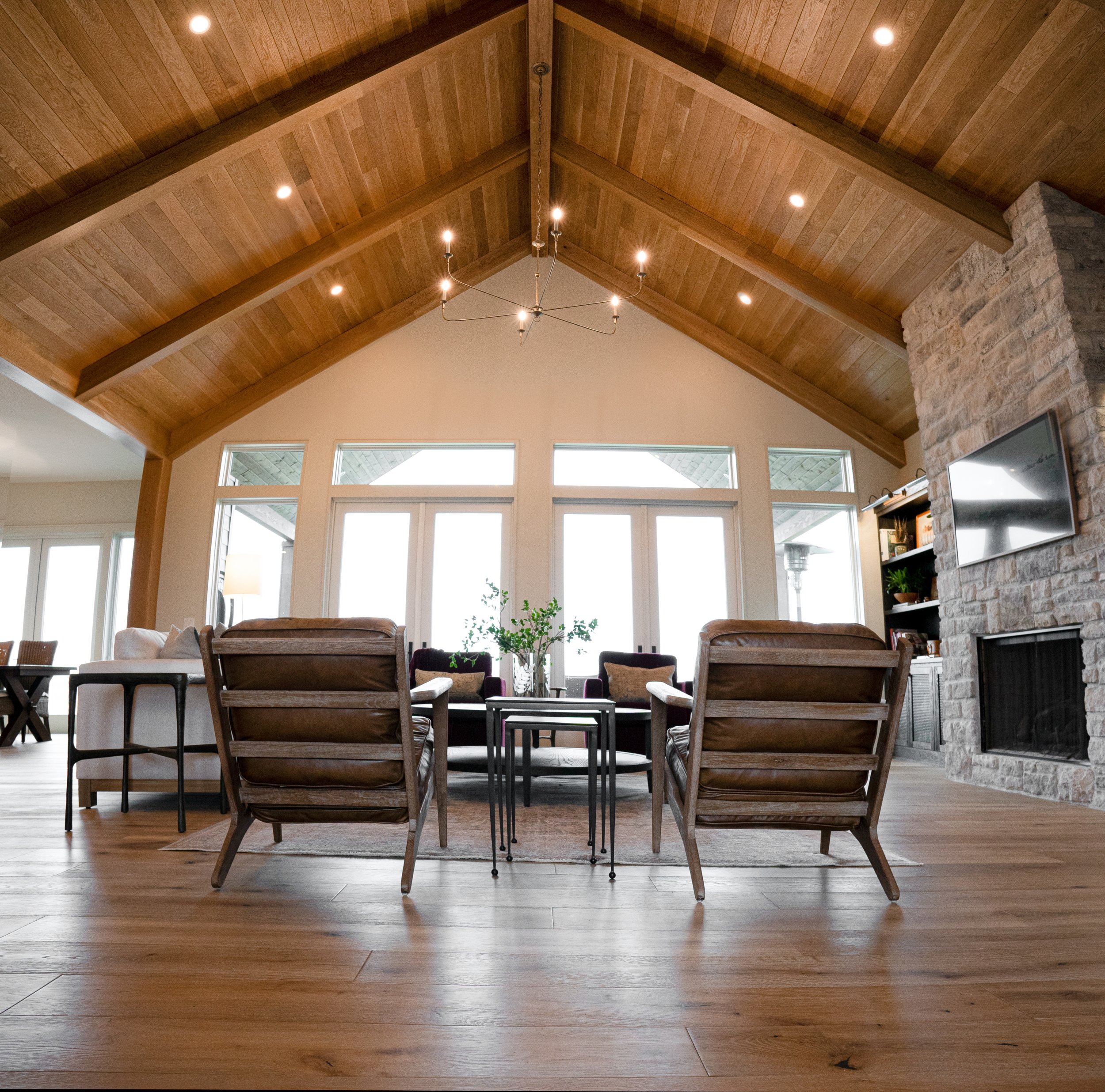 Vaulted wood ceiling and stone fireplace in a Walla Walla custom home living room by Browning Construction