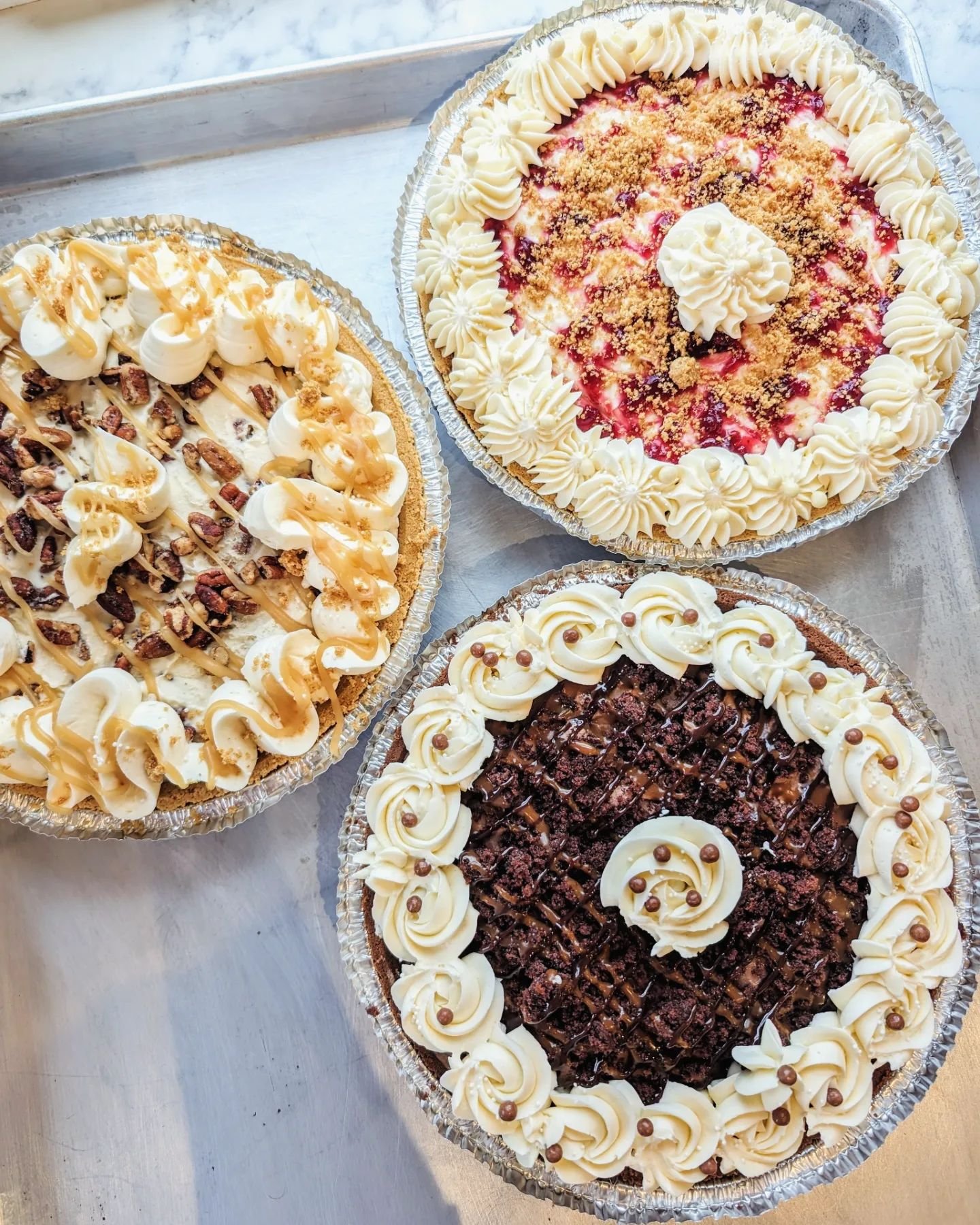 3 ice cream pies on the menu for Mother's Day!  Orders close TOMORROW, 9P.
&bull; RASPBERRY CHEESECAKE ICE CREAM PIE - graham crust, layers of cheesecake ice cream + house raspberry jam, graham crumble. Decorated with vanilla buttercream &amp; white 