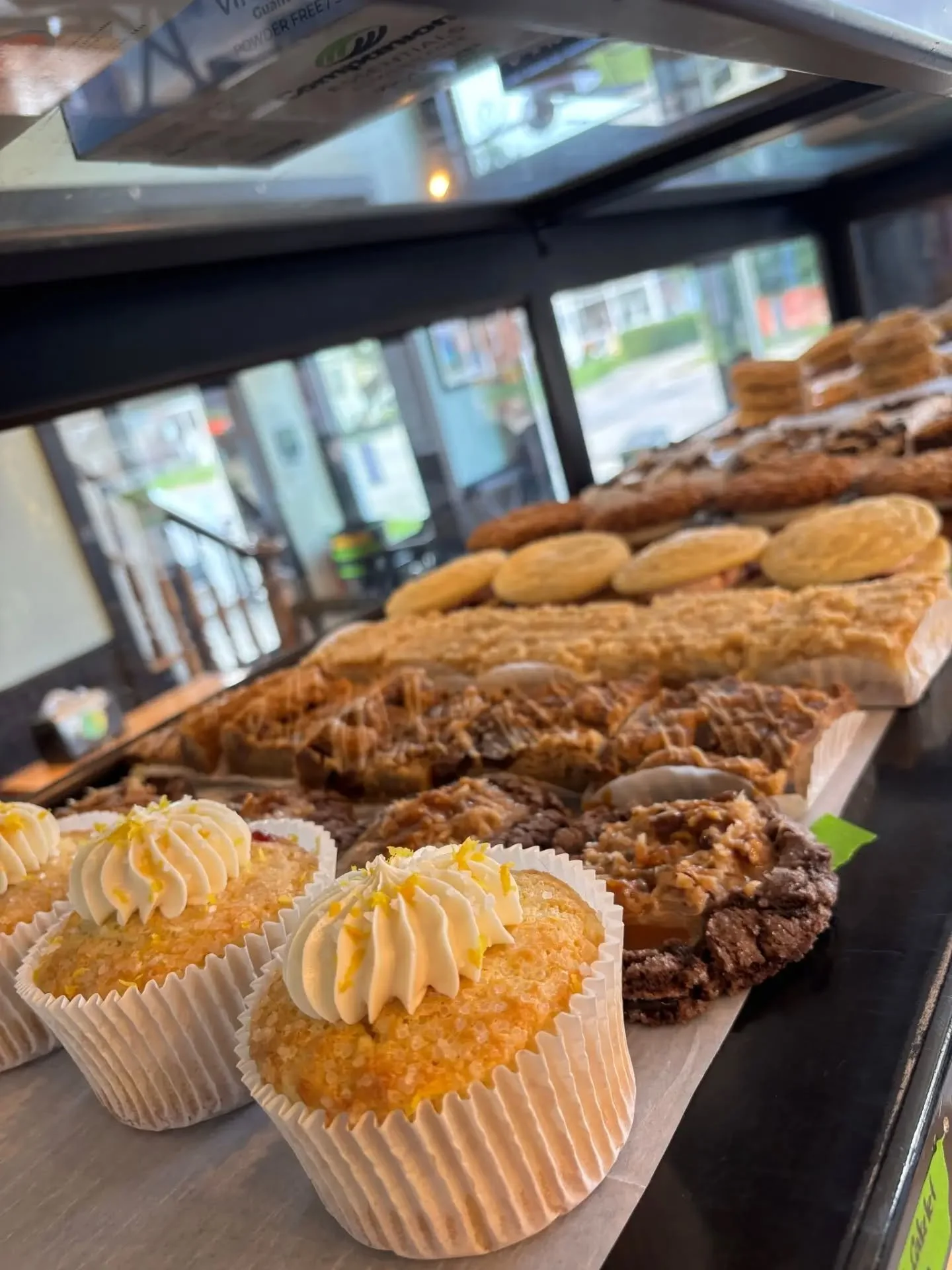 Just what we needed...a plump bakery case! 

Here's the weekend list -->
&bull; raspberry jam filled citrus coconut muffies [NEW]
&bull; German chocolate filled chocolate sugar cookies [NEW]
&bull; Reese's PB blondies
&bull; lemon streusel bars
&b