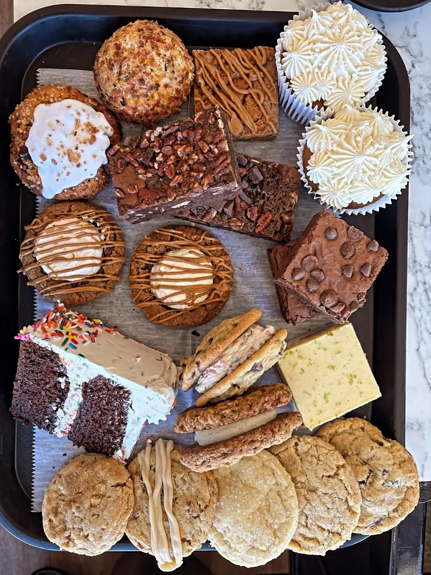 Some good bakes today! 
New to our line up:
- chocolate coconut sweet scone
- biscoff cheesecake filled cookies!! Cheesecake mousse in our molasses cookie, drizzled with biscoff
- chocolate cake with vanilla buttercream...bc it's our 7th birthday tod