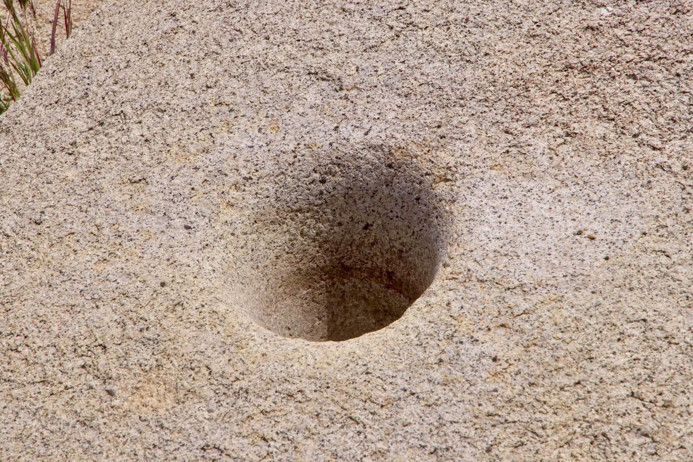 Grinding Hole - like a mortar 12" deep.