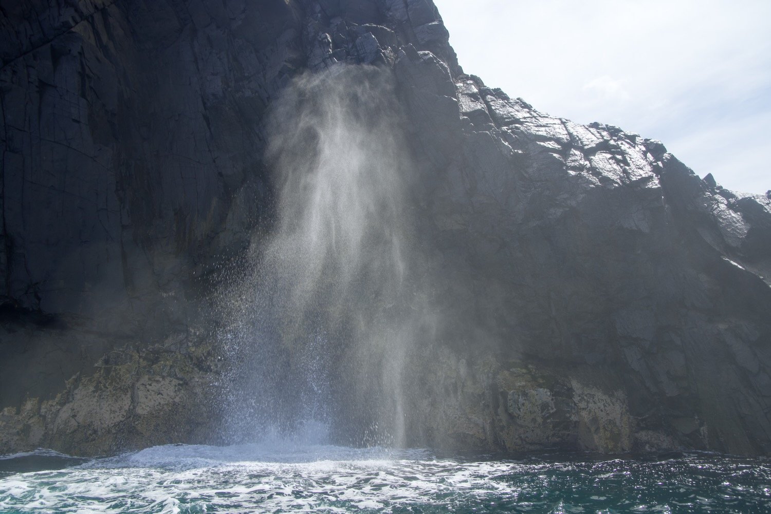 A blow hole: where the water is forced up by waves