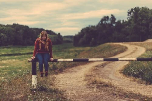 WOLF-ptsd-banner-image-girl-fence-looking-down-min.jpeg