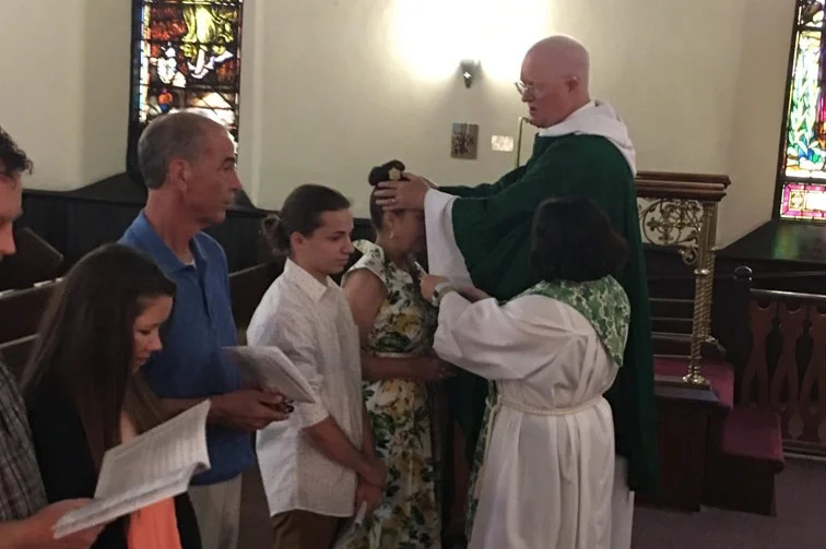 Andrea Reinwald receives a confirmation from Bishop Smith.