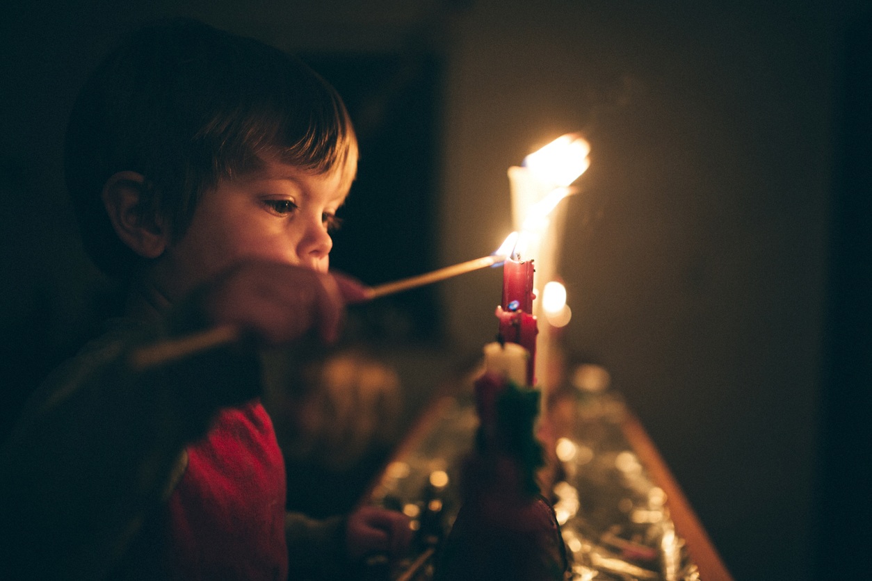 BoyLightingCandles.jpg