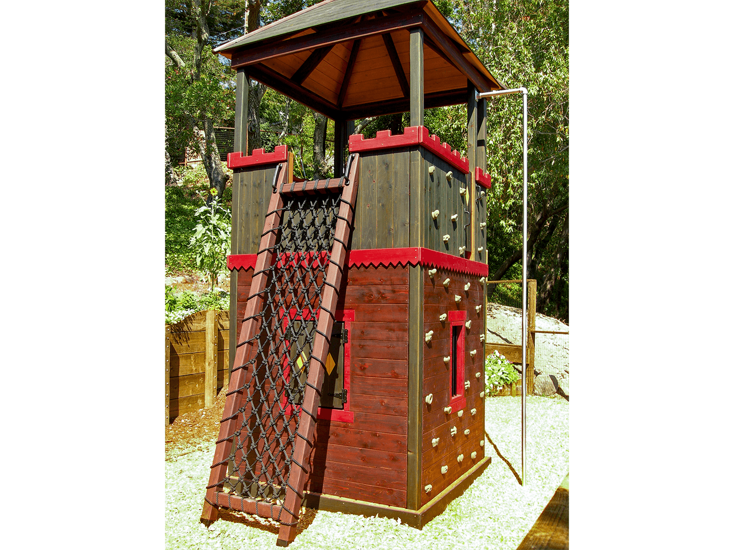  Other sides of the tower offer a rock climbing wall, fire pole, and rope net climb. 