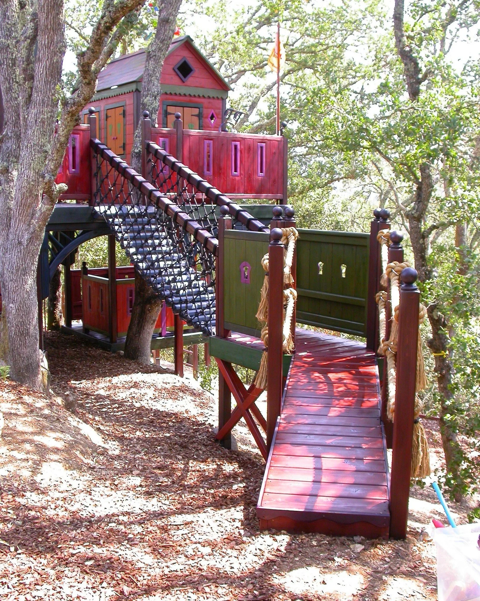 A colorful, multi-level fort in the mountains. Is this real life or a fairytale?

#kidsfort #playfort #woodfort #customfort #customkidsfort #treehouse #kidstreehouse #playtreehouse #treehouselife #treehouseretreat #treehouseinwoods #fortinwoods #cust