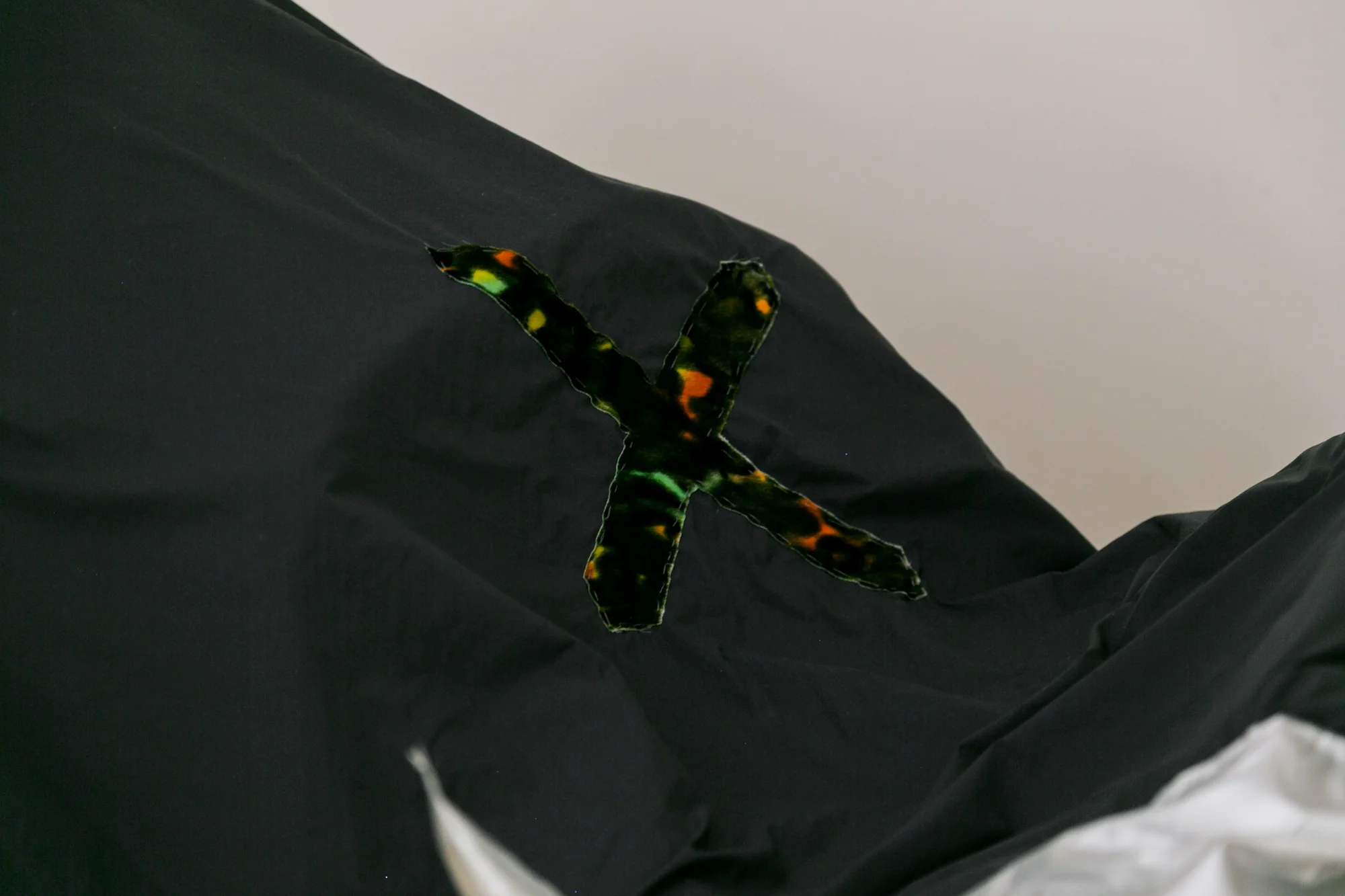 Laura Hunt, Motorcycle Cover 3 , 2018 (detail), silk velvet, nylon, and three altered motorcycle covers with hand-sewing, approximately 66 x 42 inches, dimensions variable.
