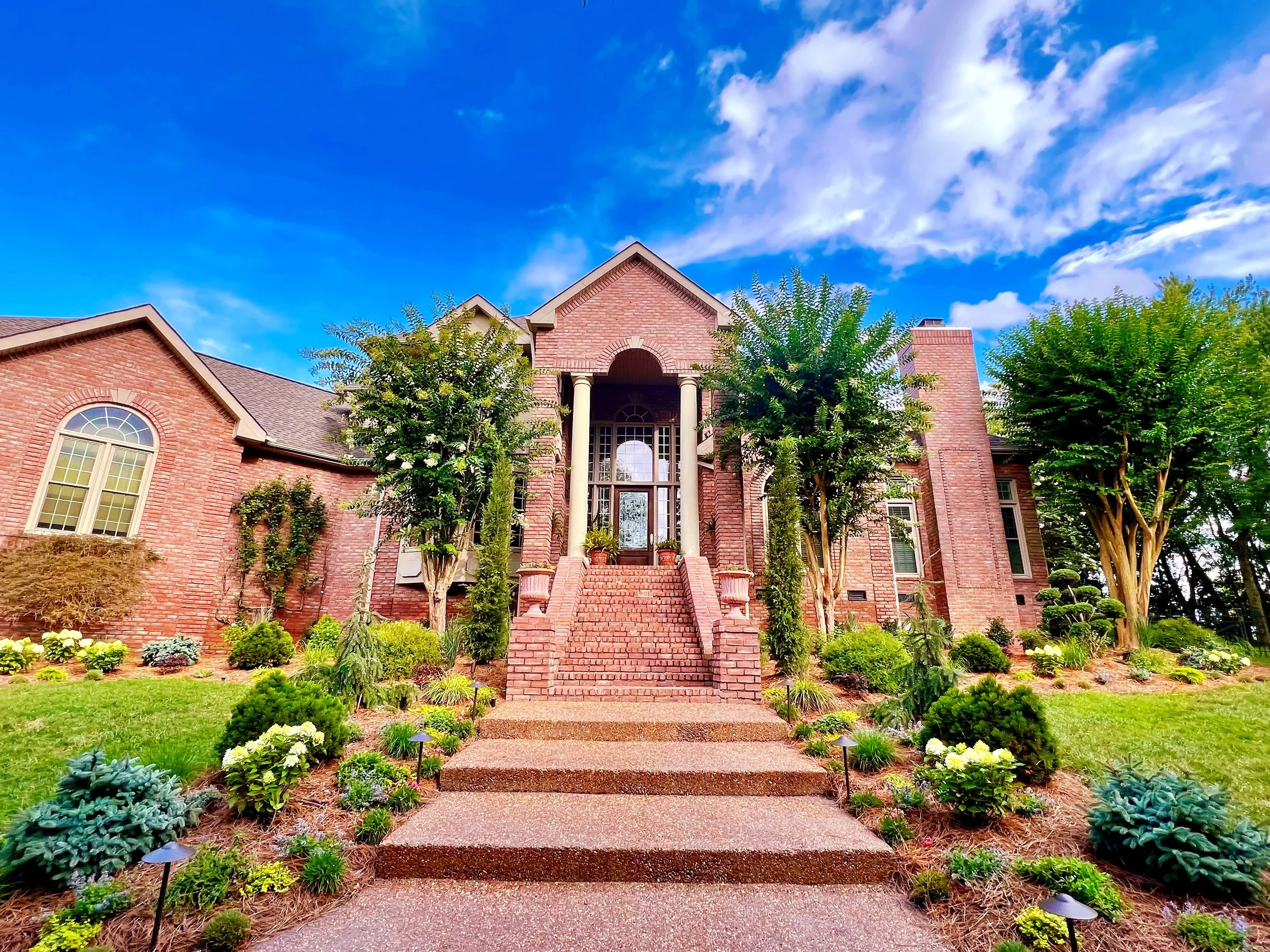 From Dull to Divine: Experience the Breathtaking Transformation of a Nashville Home's Landscaping into a Year-Round Lush Oasis