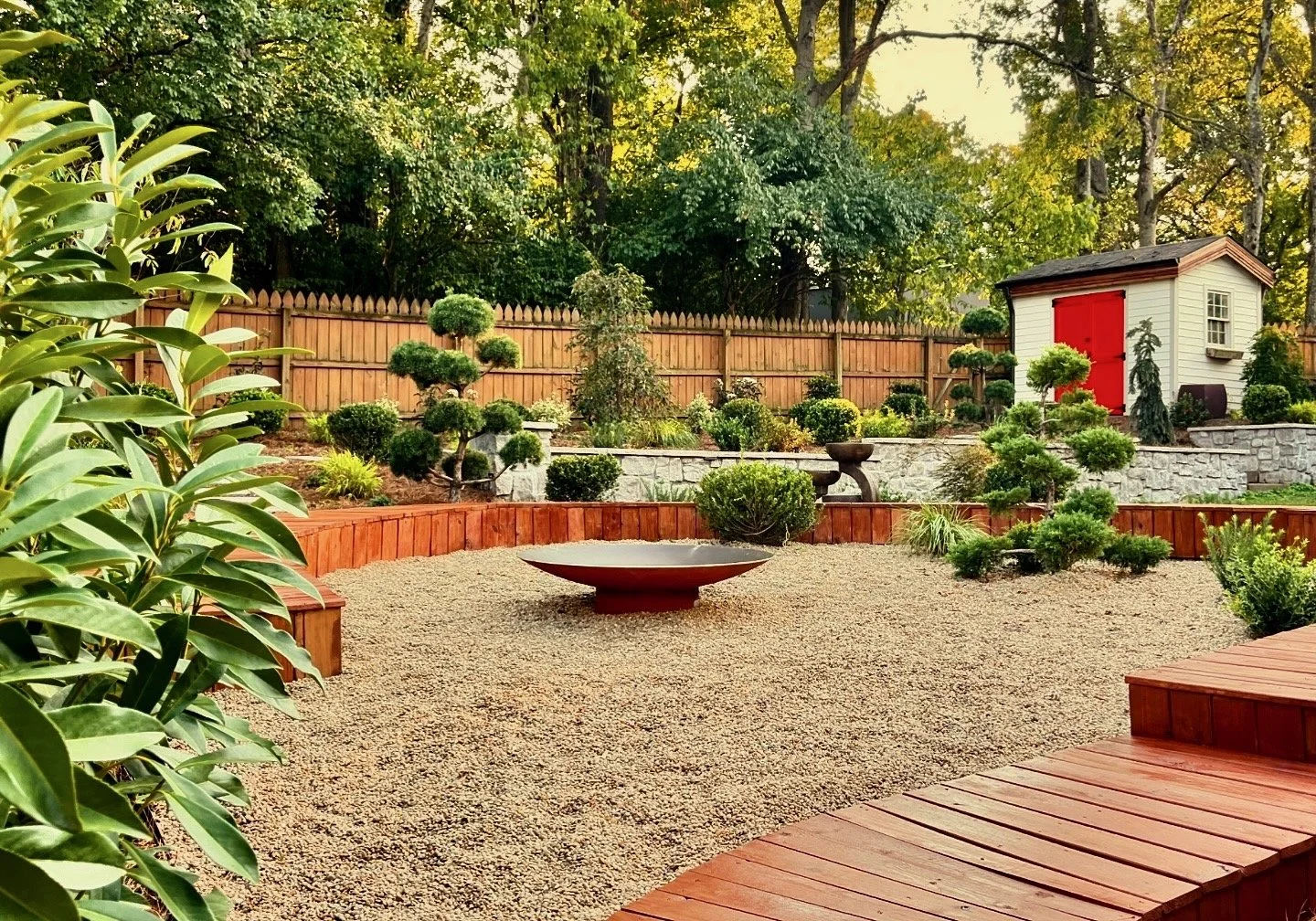 [Nashville back yard Japanese garden with gravel patio, circular wood decking, topiary pom trees, and water feature.] - Meditation Garden Design by The Grass Girl