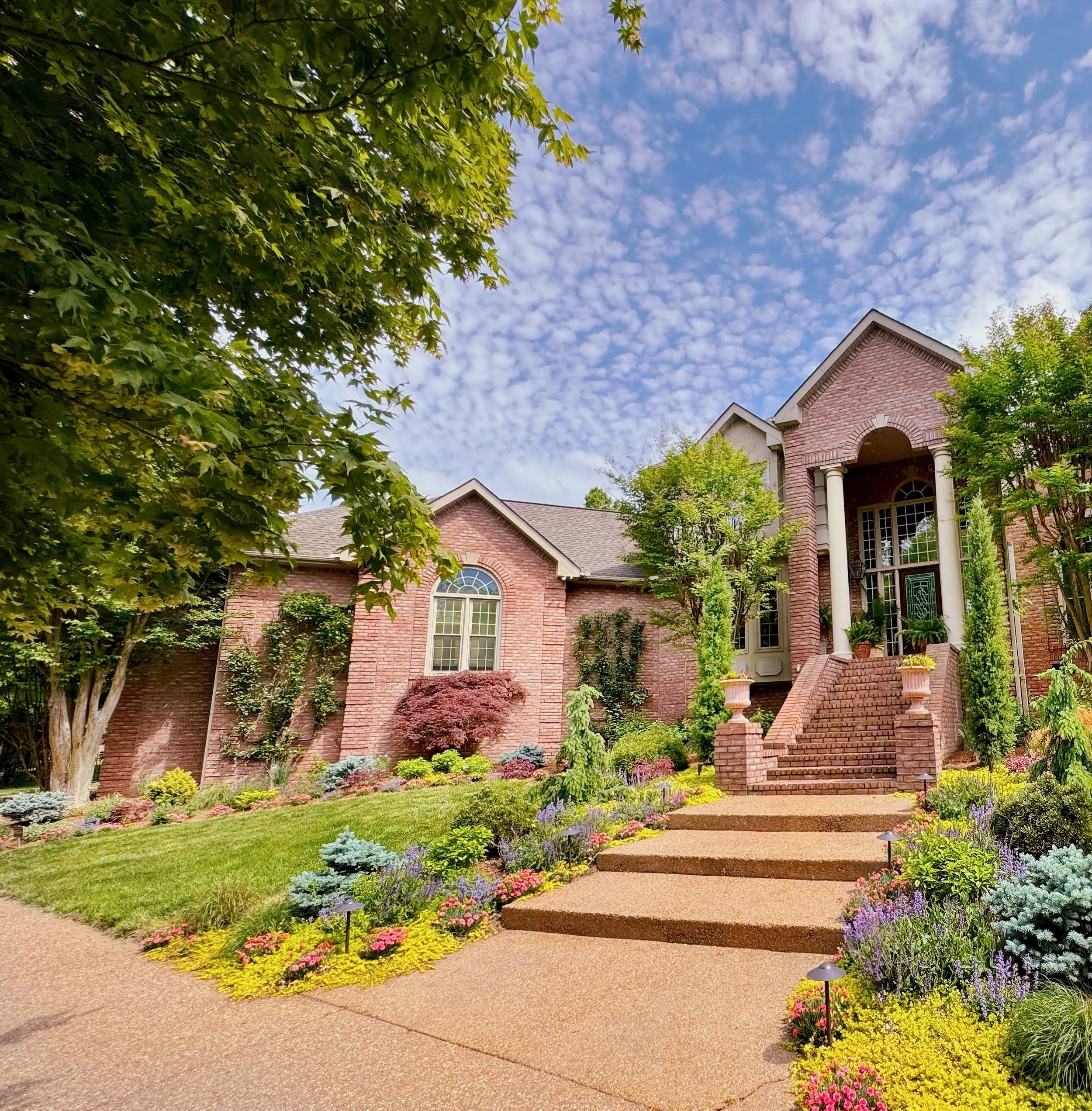 The-front-of-a-Wilson-County-home-transformed-with-color-by-TN-garden-designer-the-grass-girl