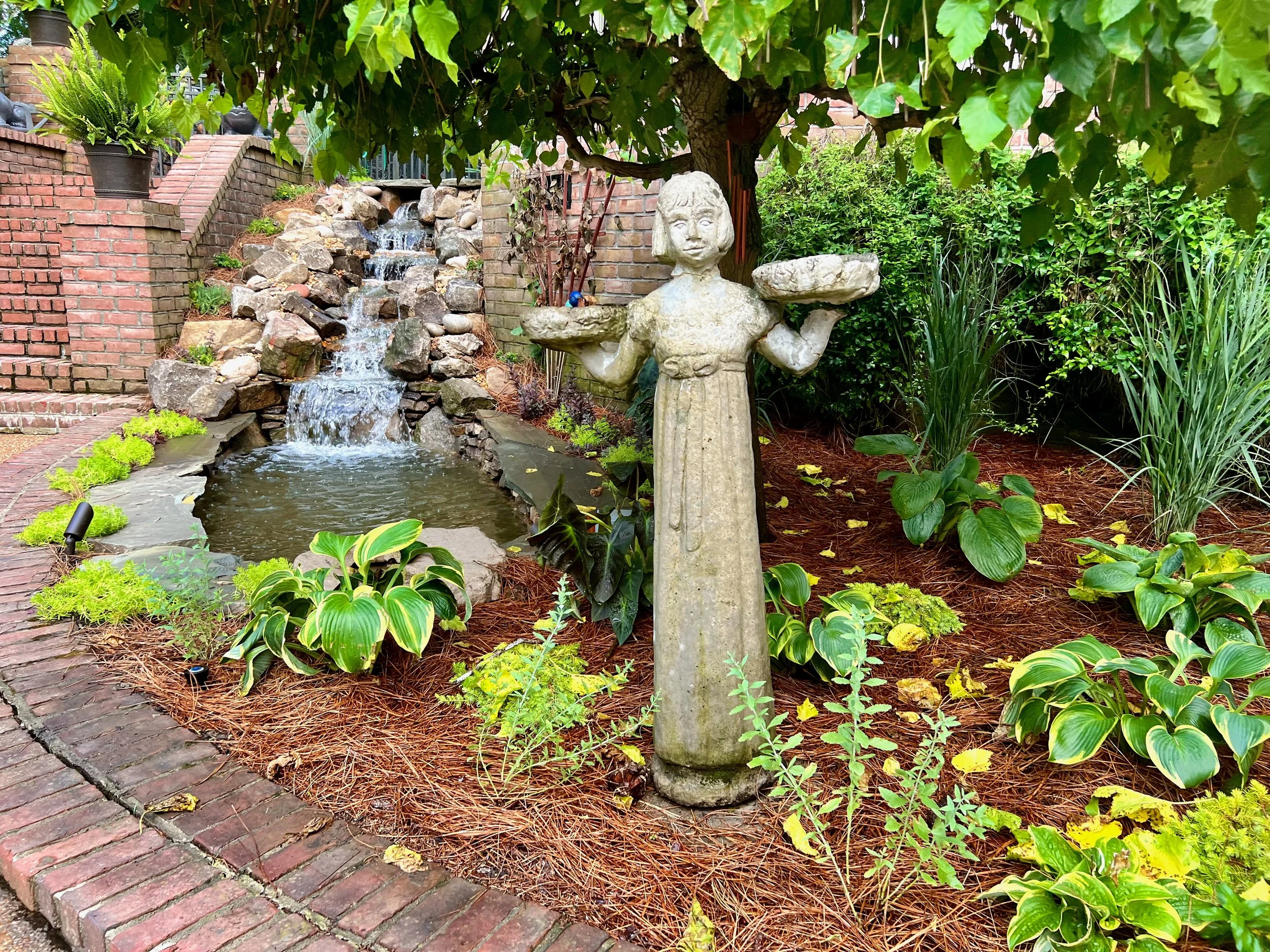A residential waterfall pond in a shade garden in Lebanon, TN, designed by The Grass GIrl
