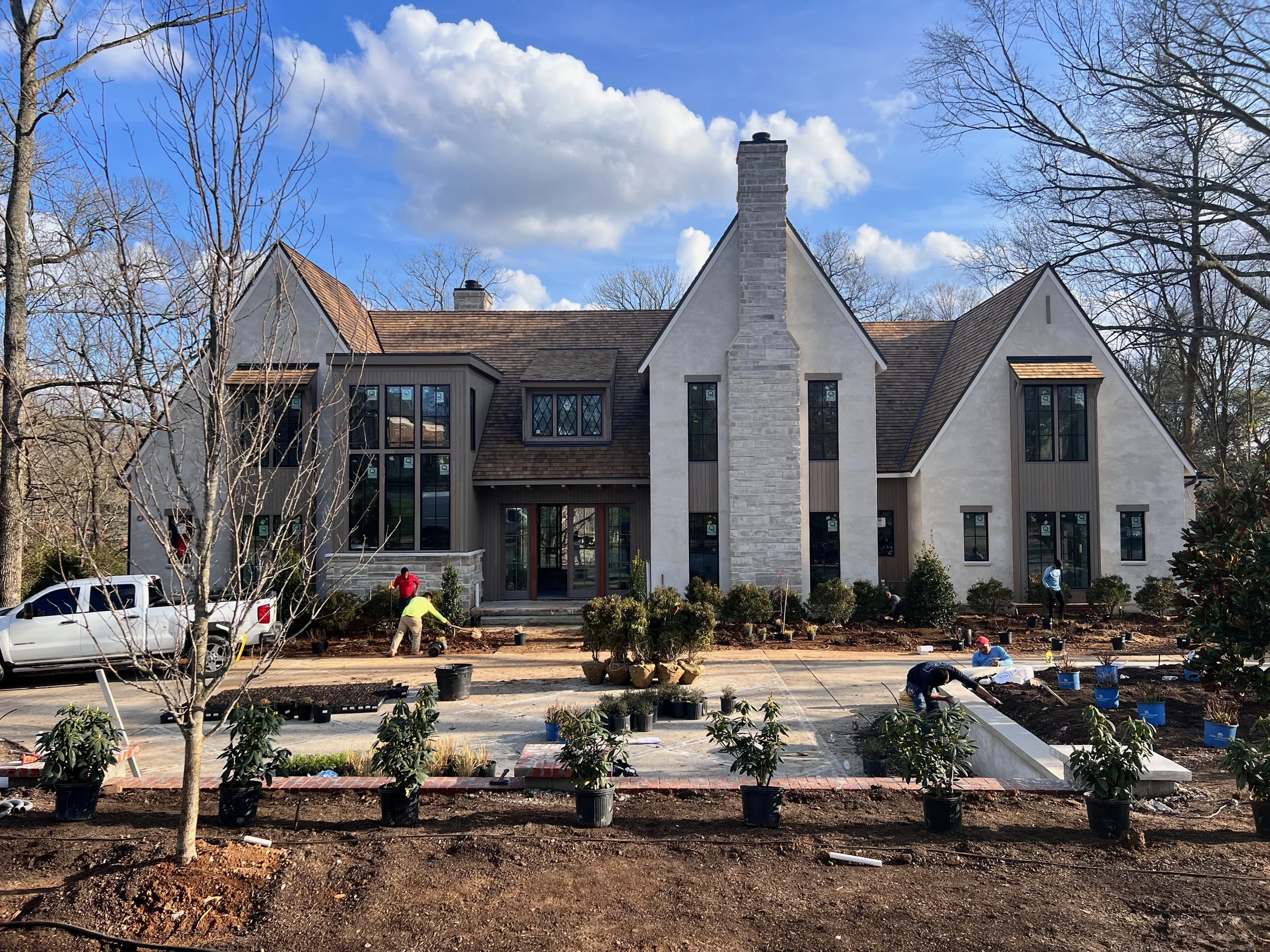 Fall landscape installation at a Middle Tennessee estate property, burlapped root balls staged for planting in dormant winter light, by Nashville garden and landscape designer The Grass Girl