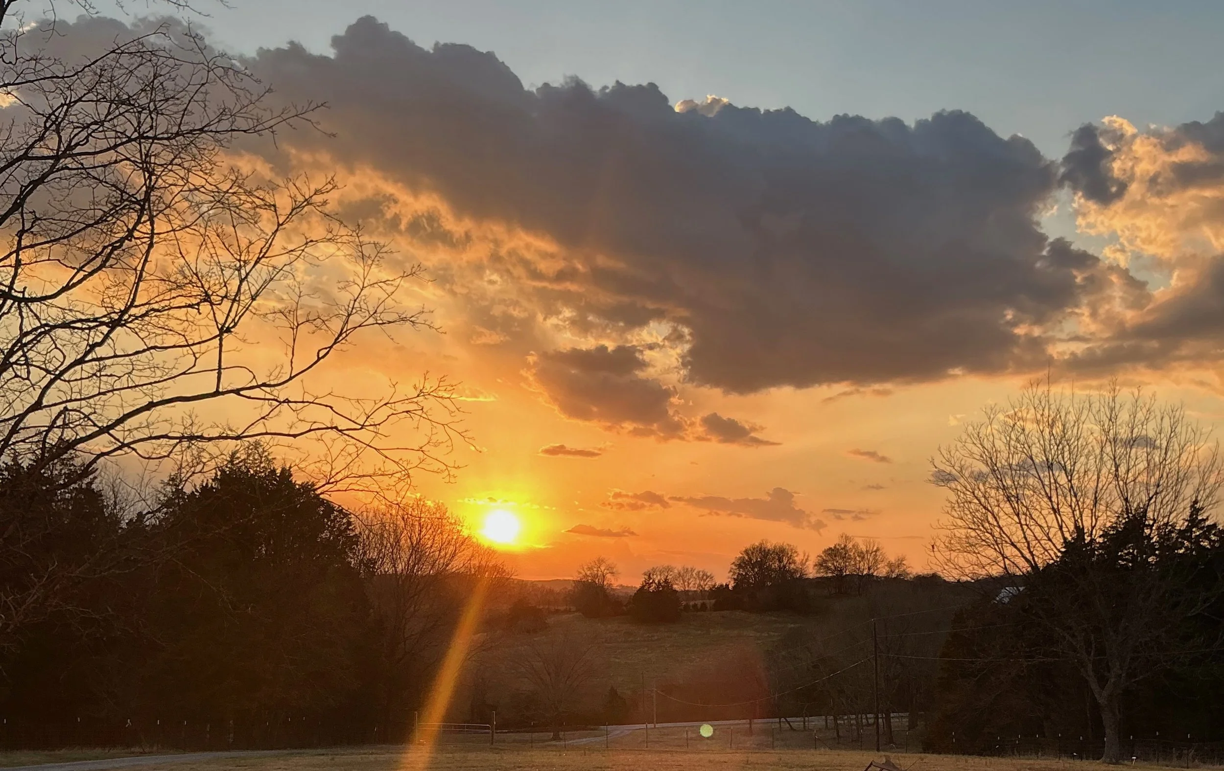 Sunset on rural hills in February in rural acreage in middle TN