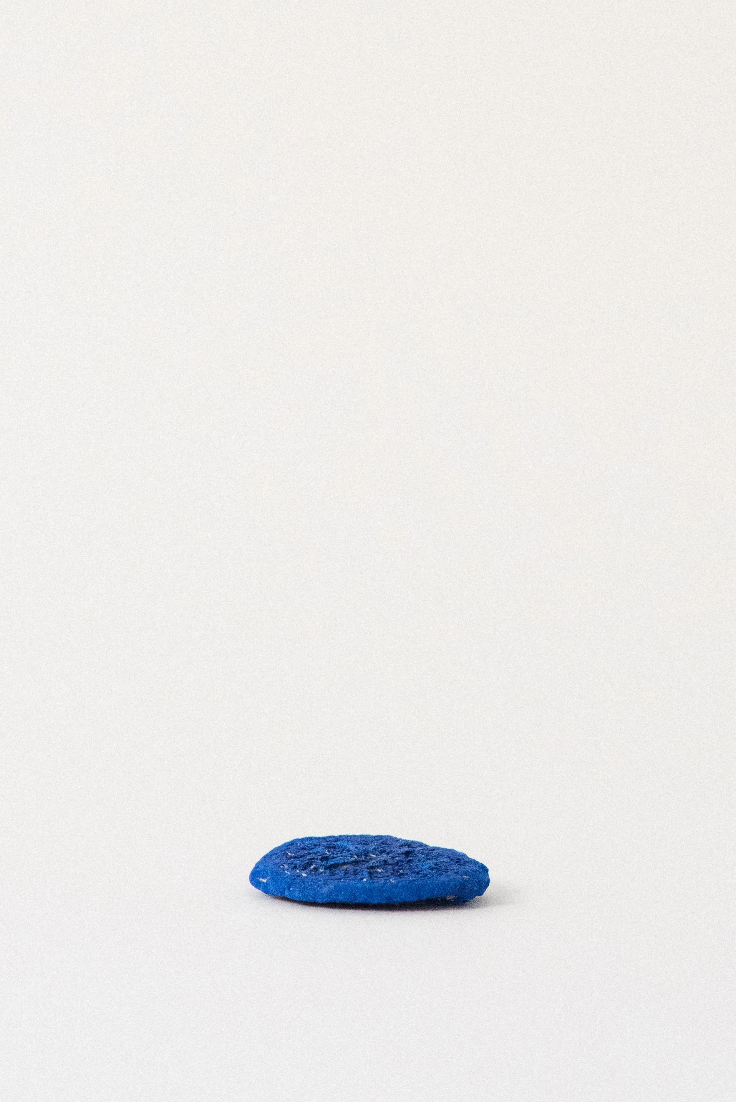 Single deep blue azurite sun specimen from the Malbunka Copper Mine in Australia, shown without matrix on a neutral background.