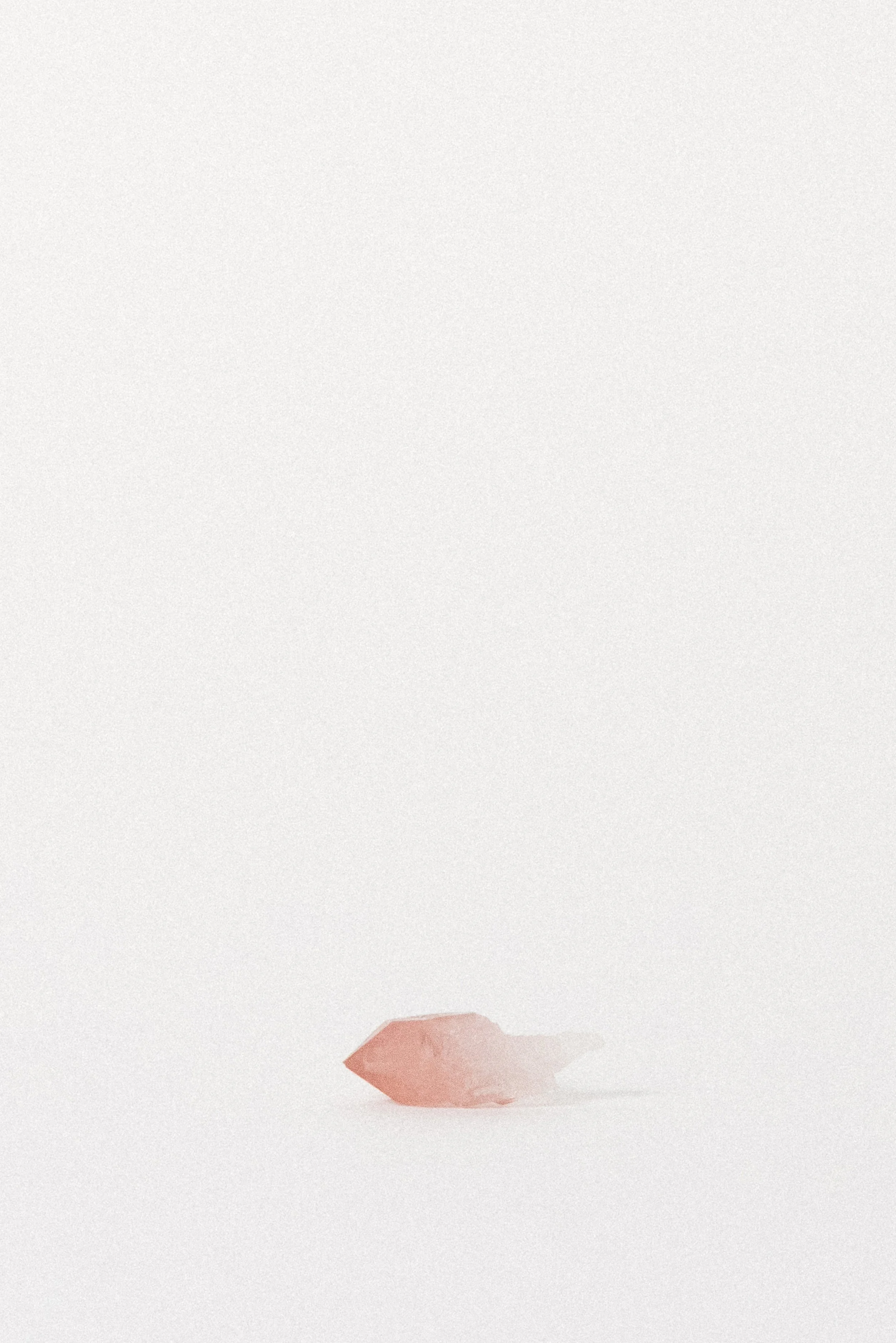 Close-up of the Pink Quartz crystal highlighting smooth faces and natural color zoning.