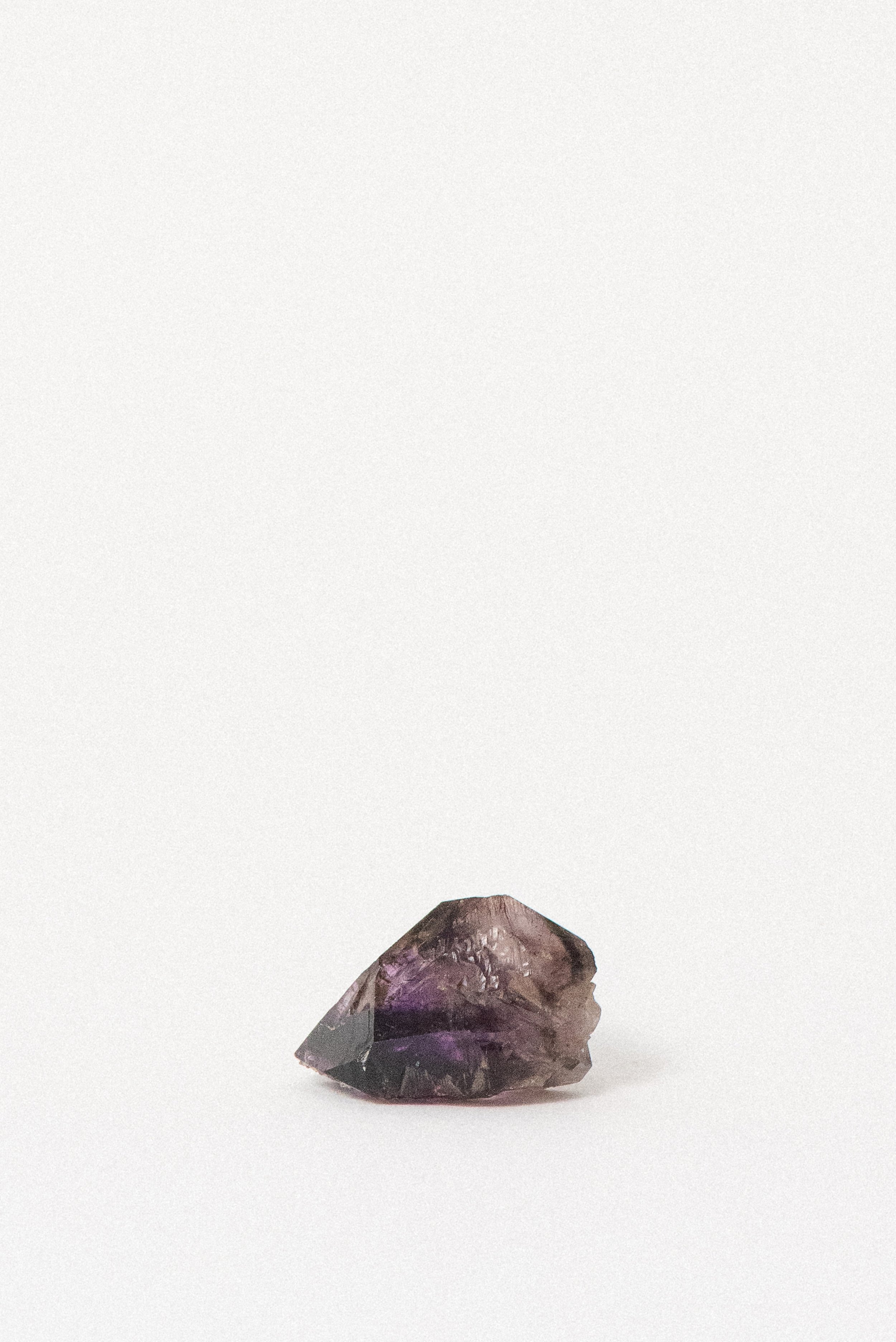 Natural Shangaan Amethyst crystal from Zimbabwe with layered inclusions and color zoning
