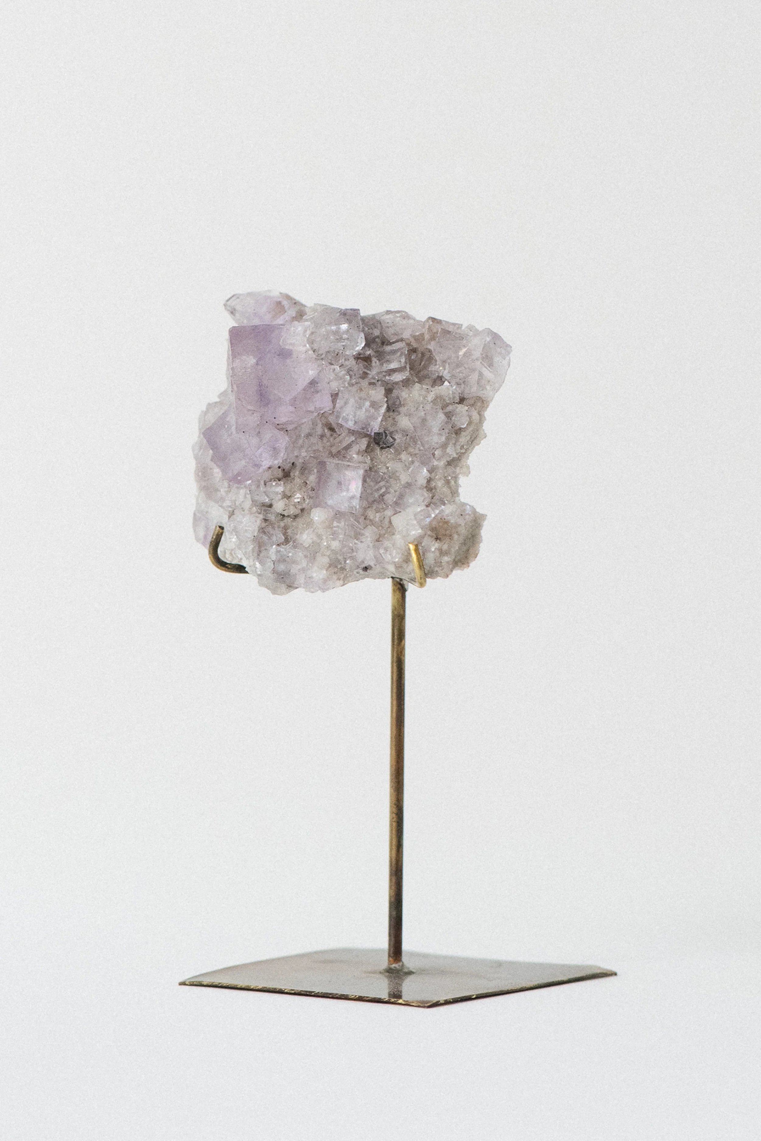 Side angle revealing matrix texture and dolomite placement beneath fluorite cubes