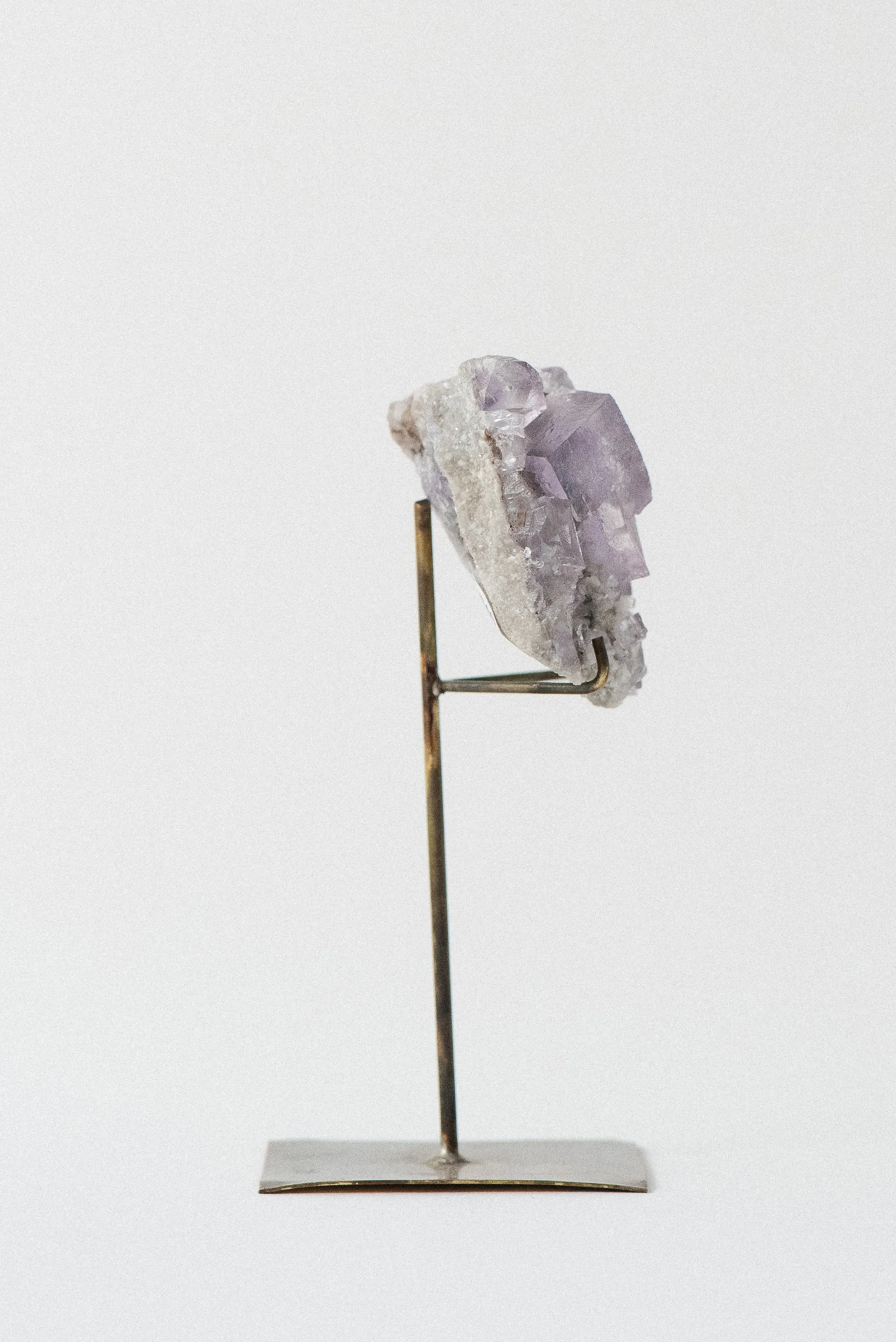 Left profile showing purple fluorite and white dolomite on host matrix from Tennessee