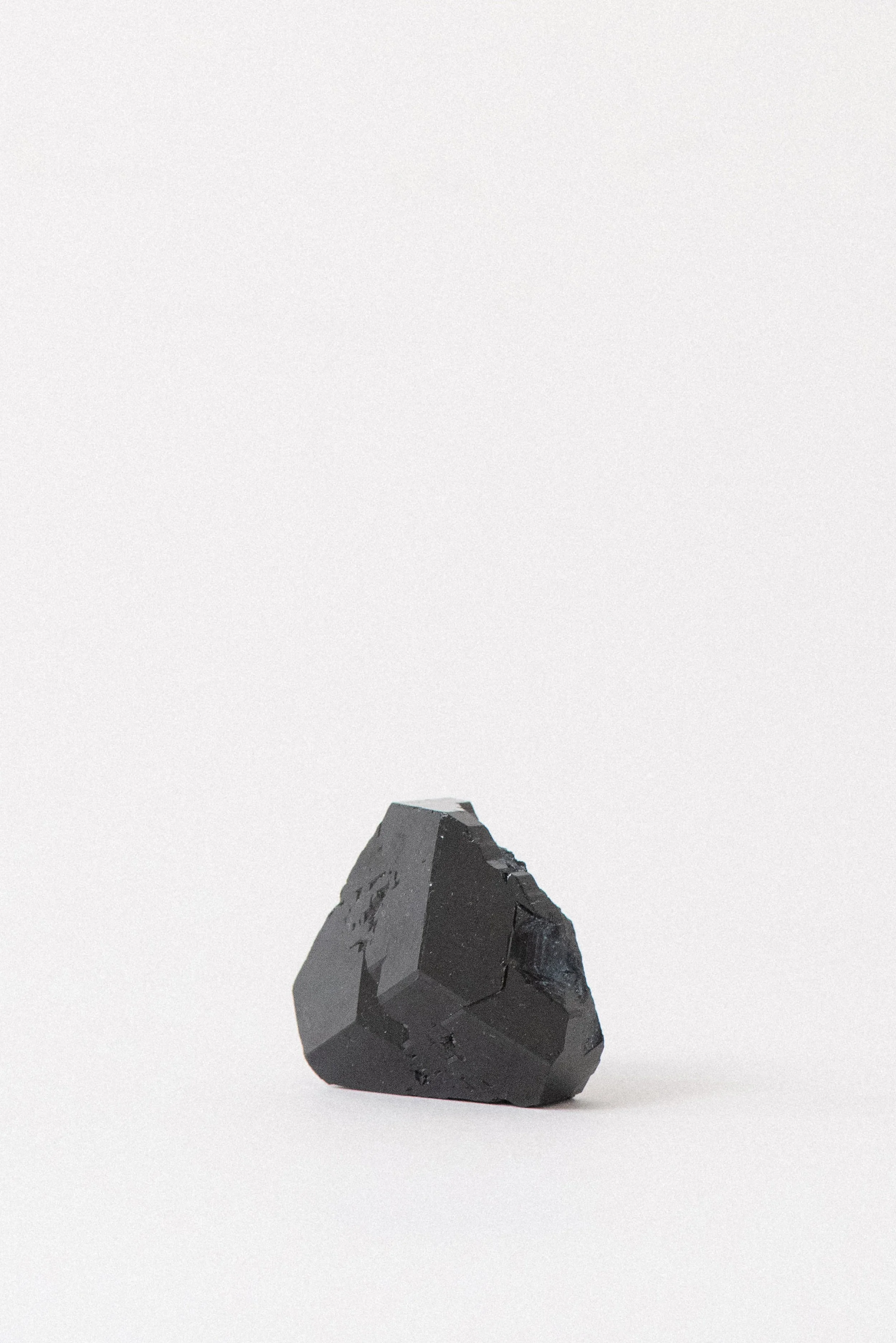 Detailed texture of ethically sourced black tourmaline for healing and root chakra alignment.