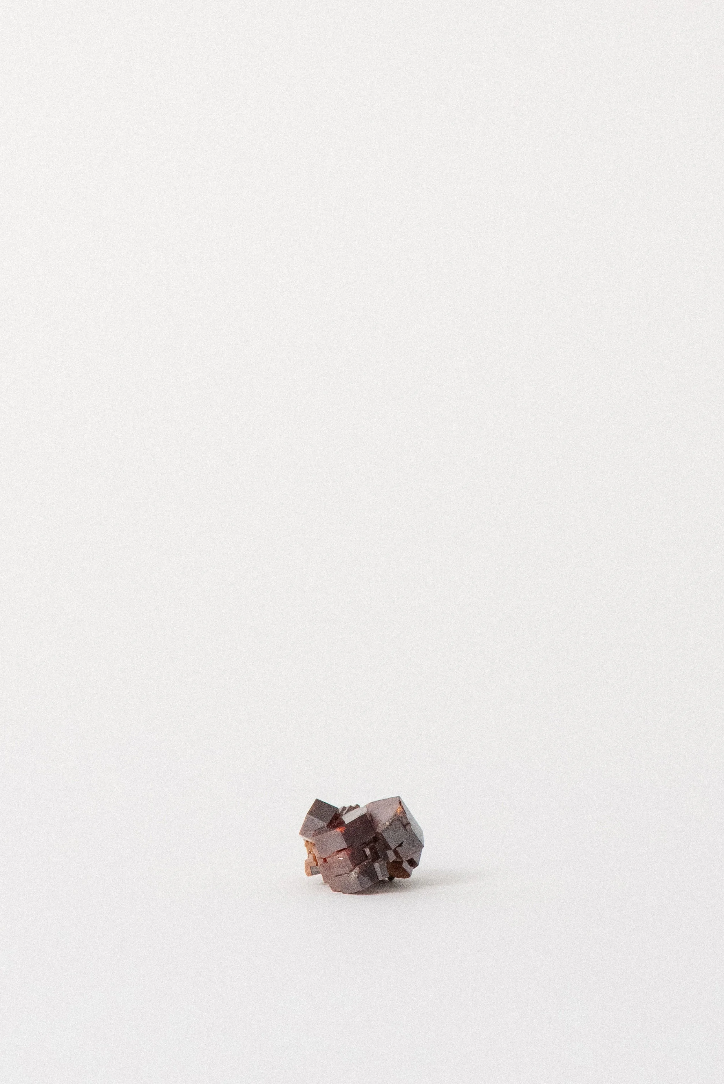 Compact Vanadinite piece with defined geometric crystals and matrix detail.