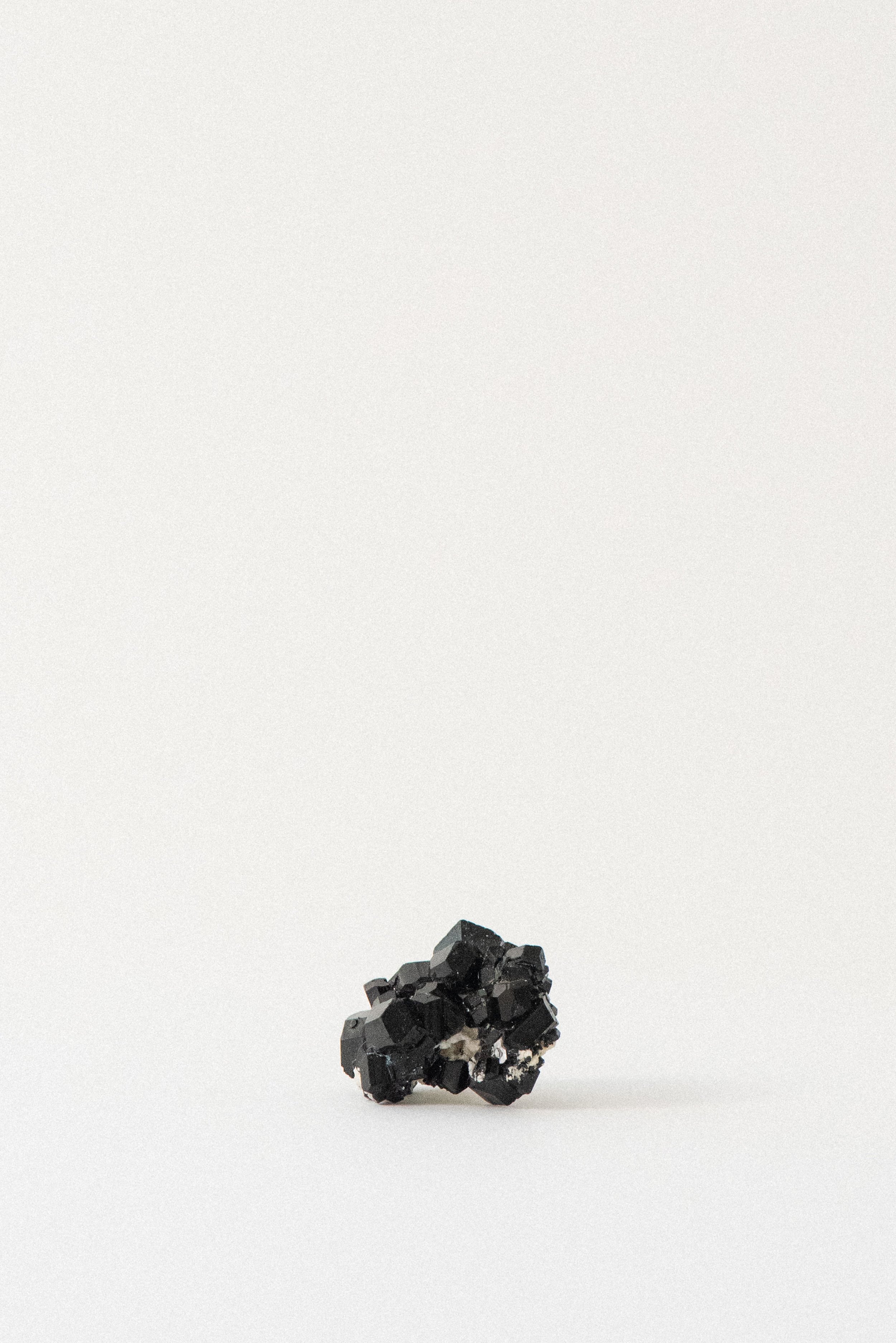Lustrous black tourmaline crystal cluster from Erongo, Namibia, showcasing sharp terminations and natural texture.