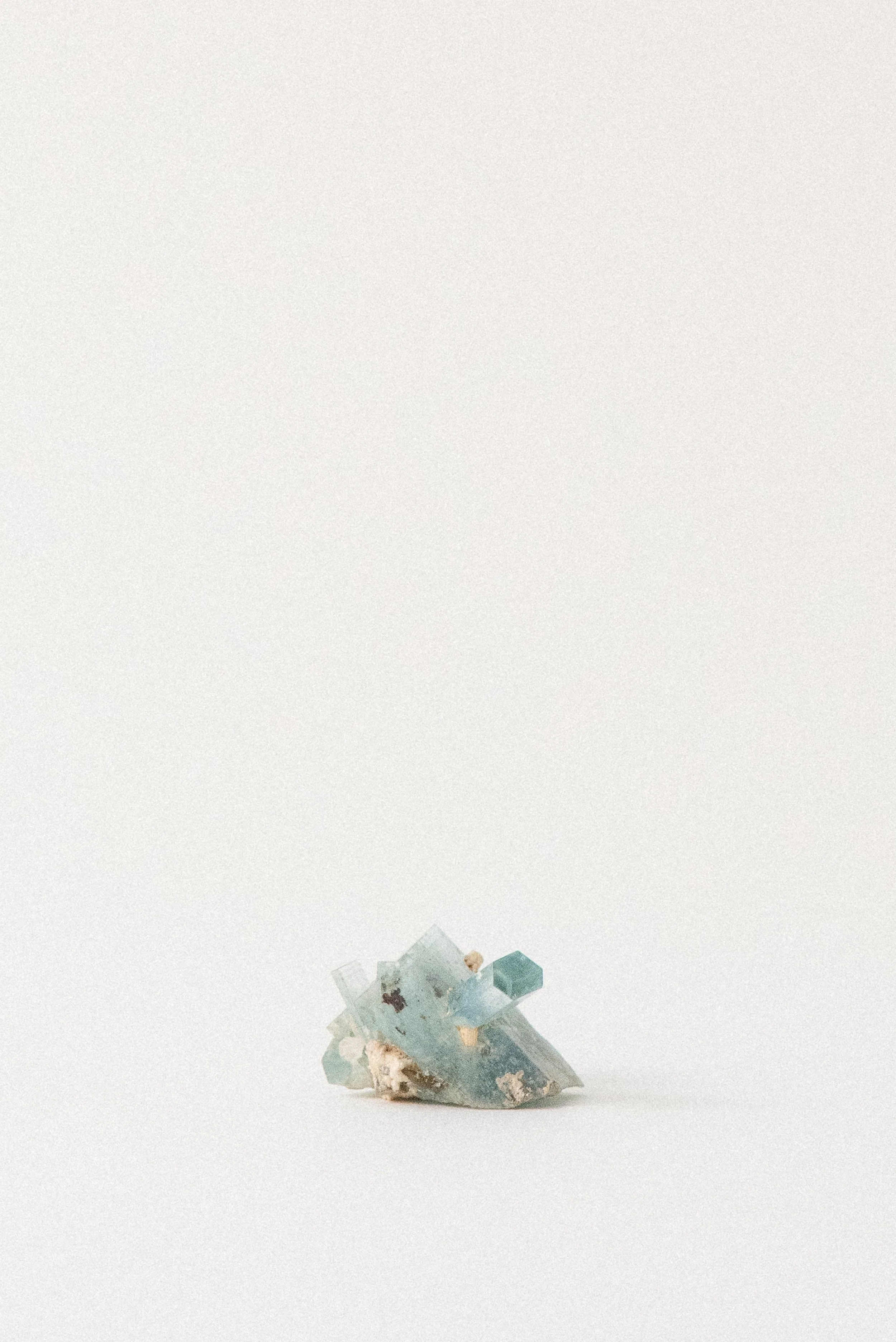 Cluster of aquamarine crystals from Erongo Mountain, Namibia, on minimalist white background