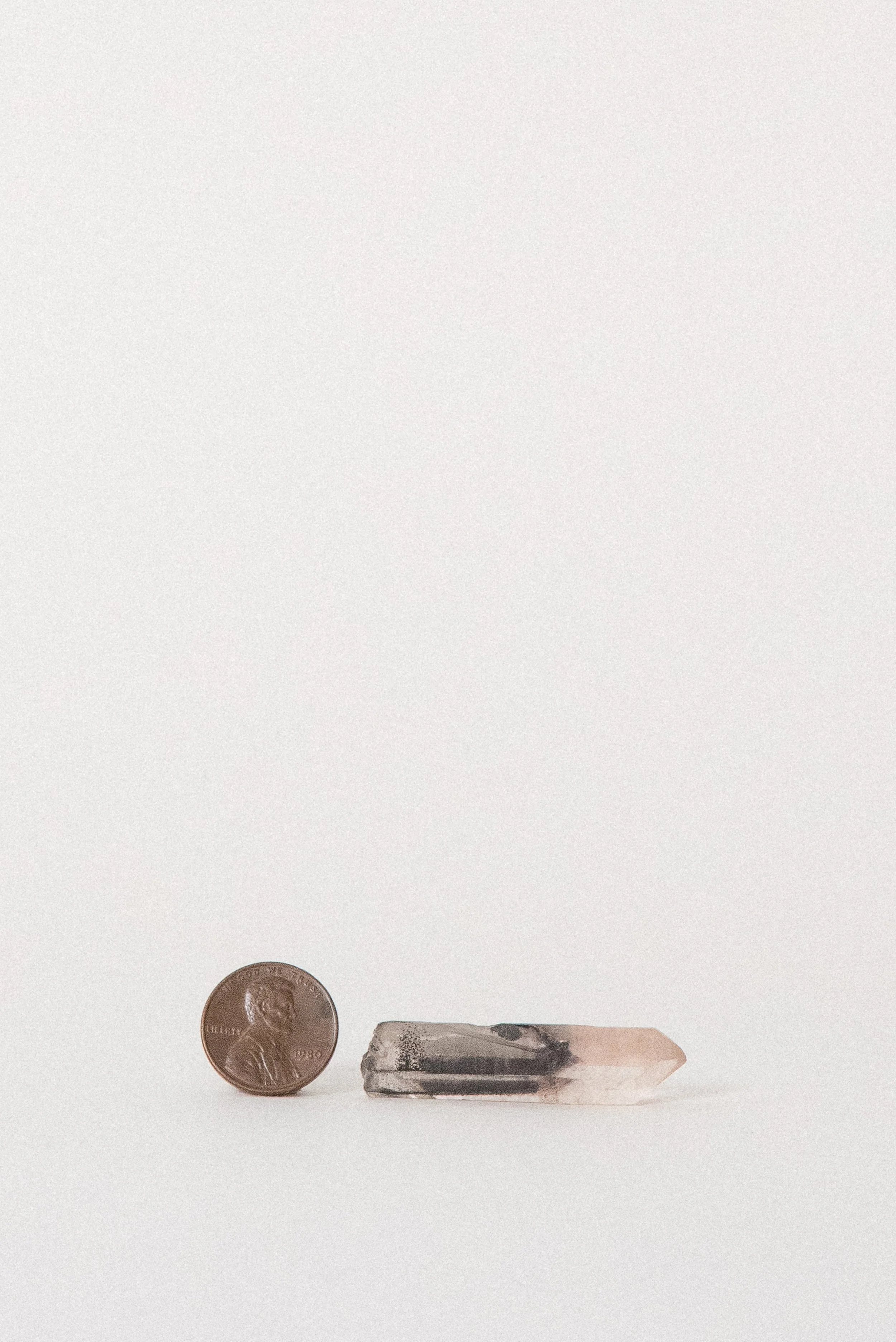 crystal-voyager-quartz-point-with-hematite-karur-india-4.jpg